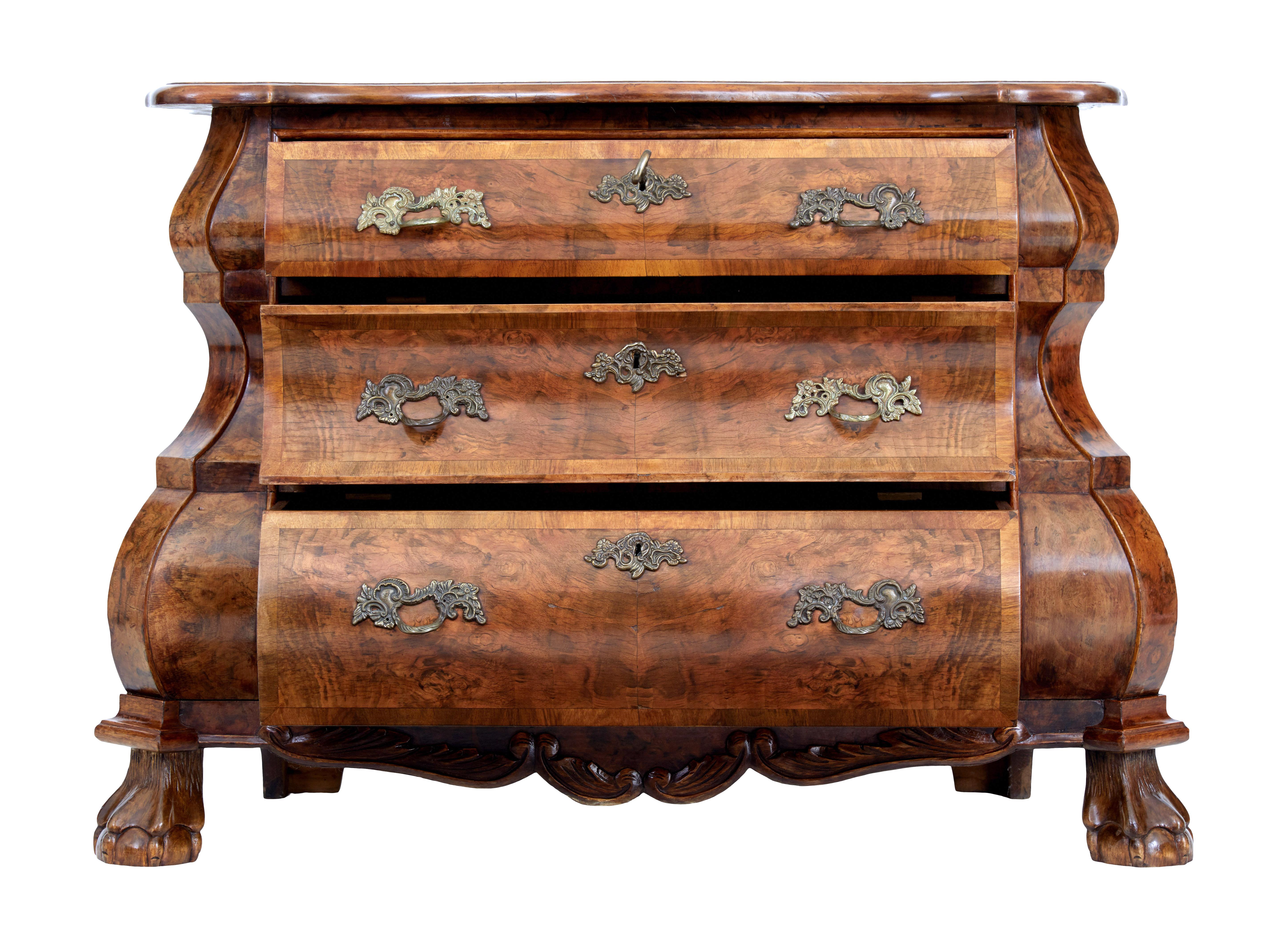 Fine quality dutch walnut shaped commode circa 1900.

Beautiful quality walnut veneers used on this well proportioned Dutch chest of drawers. 3 shaped graduating drawers with crossbanded edge, original ornate handles and escutheons. Carved