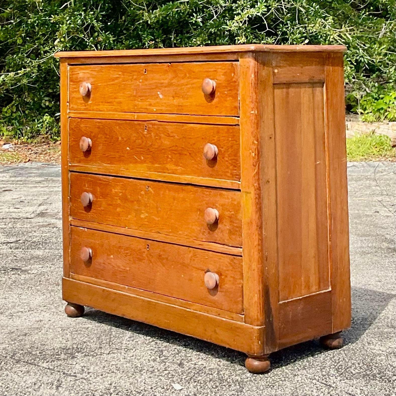 A classic American Primitive chest of drawers. A beautiful all over patina from time and gorgeous wood grain detail.