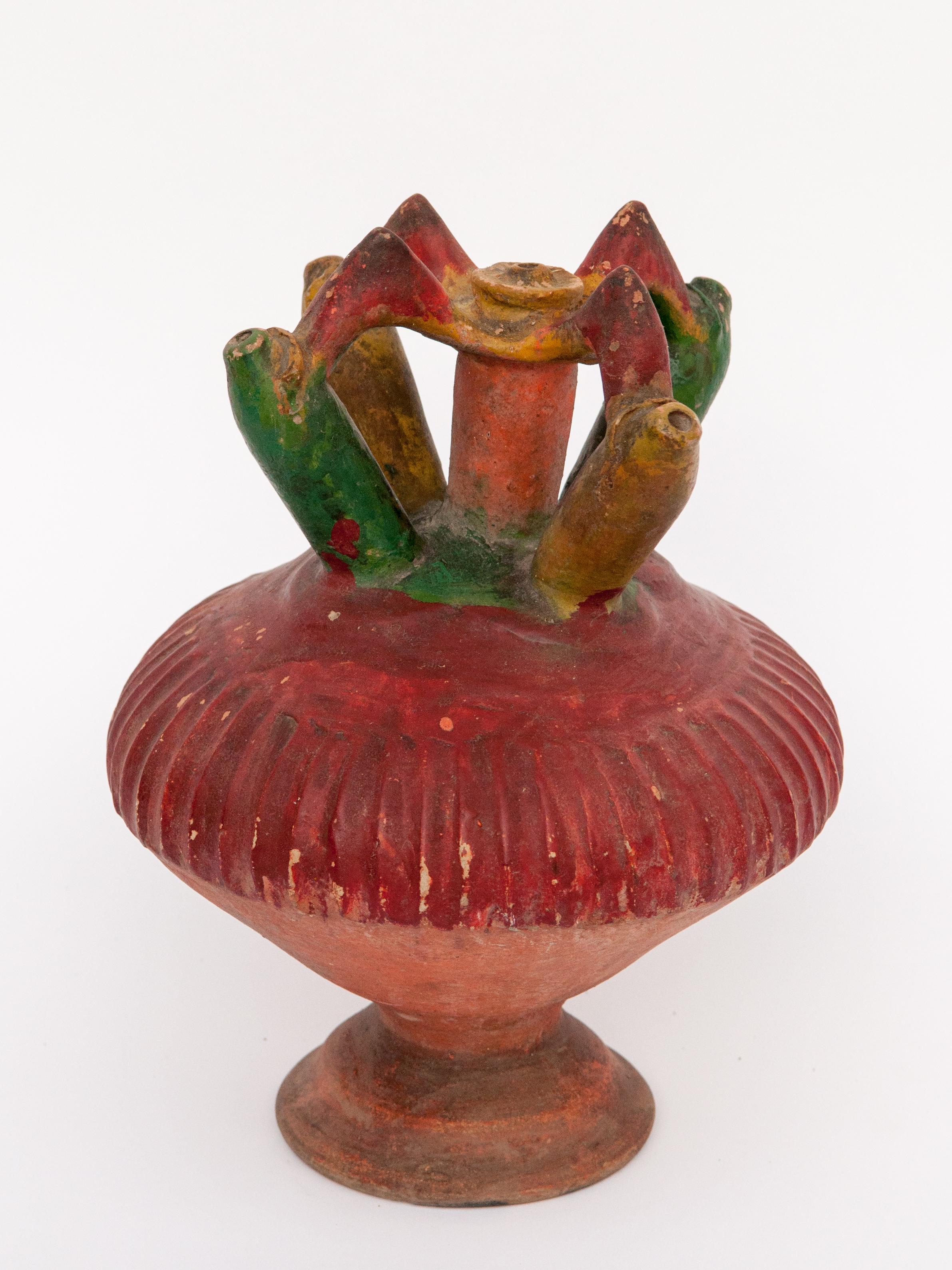 Kendi Earthenware Ritual Ceramic Vessel with Original Color, Sumatra. Early 20th Century.
Kendi are pouring and drinking vessels found throughout Southeast Asia since ancient times. This multi spouted example is from Palembang, Sumatra, and dates to