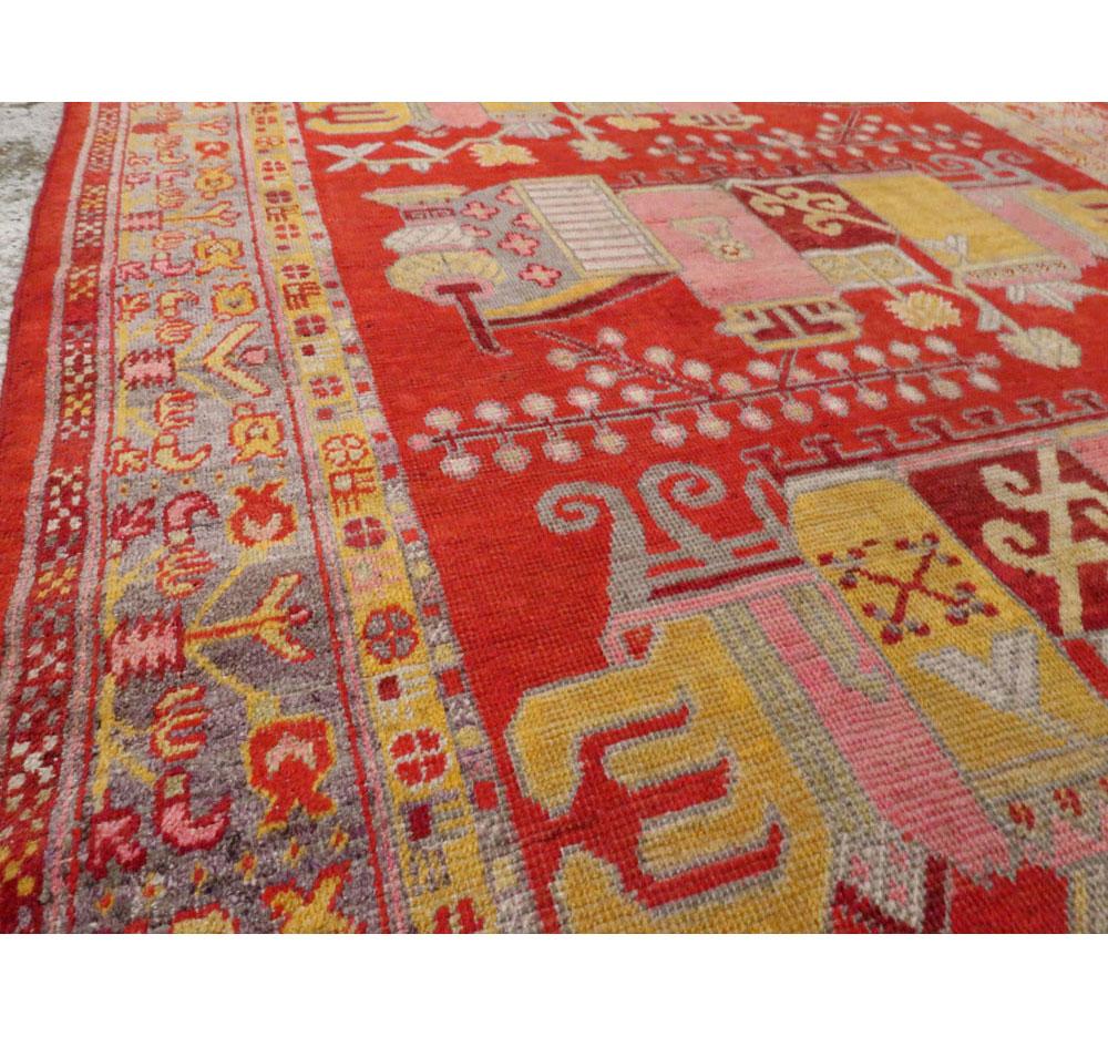 Wool Early 20th Century East Turkestan Pictorial Vase Khotan Small Gallery Rug in Red For Sale