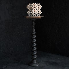 Early 20th century ebonised unusual shaped carved wooden plinth