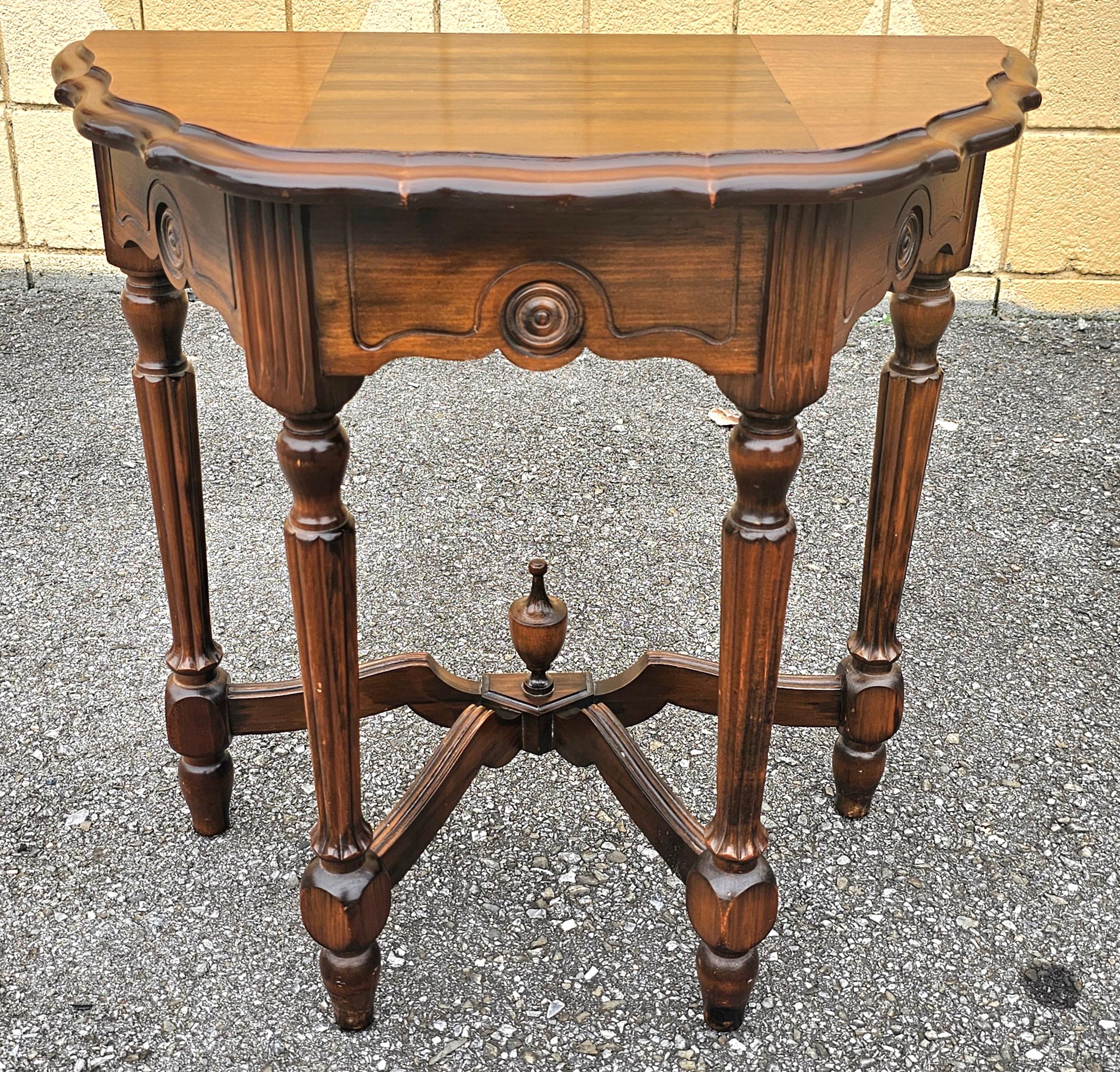 An Early 20th Century Edwardian carved Walnut Stretcher Demilune Console Table, Circa 1920s. Measures 24