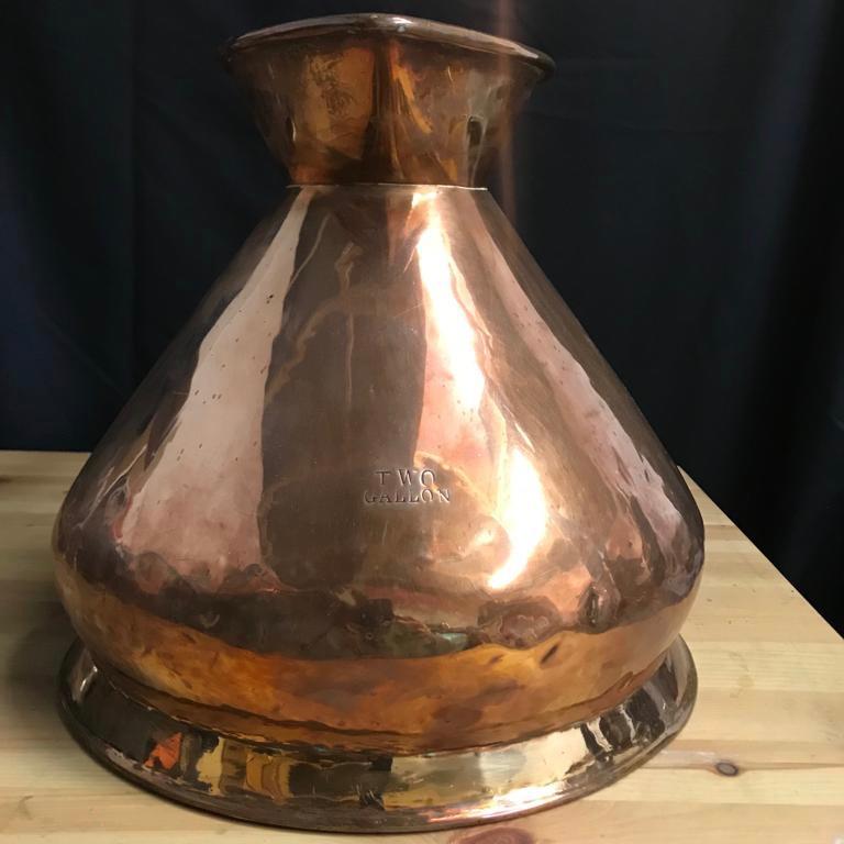 An Edwardian copper haystack 2-gallon measure, that has an official lead verification seal in the rim of E.R L.C.C - Edward Royal London County Council. 
The measure was used in taverns to truthfully measure ale or cider to protect society from