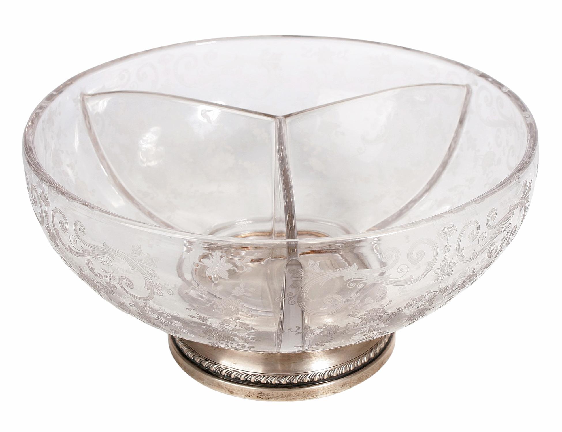 Early 20th century Edwardian etched crystal glass salad bowl with silver foot, United Kingdom

By: unknown
Material: glass, crystal, metal, silver, cut glass, silver plate
Technique: polished, metalwork, cast, molded, pressed, silvered, plated,