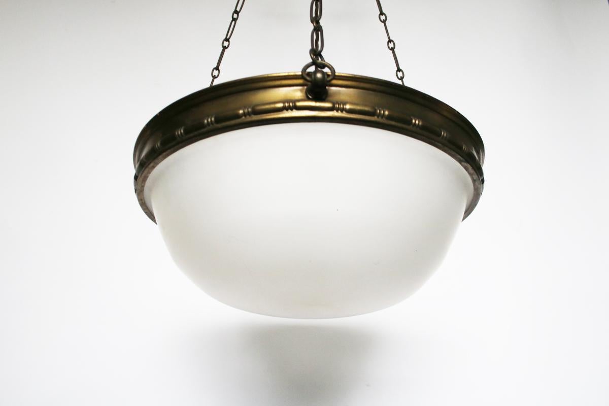 Large early 20th century Edwardian hanging ceiling light with satin glass bowl in a brass ring decorated with bead and bar detail suspended from 3 chains terminating in a decorative ceiling rose. 

Measures: 102 cm drop x 48cm diameter.

Rewired