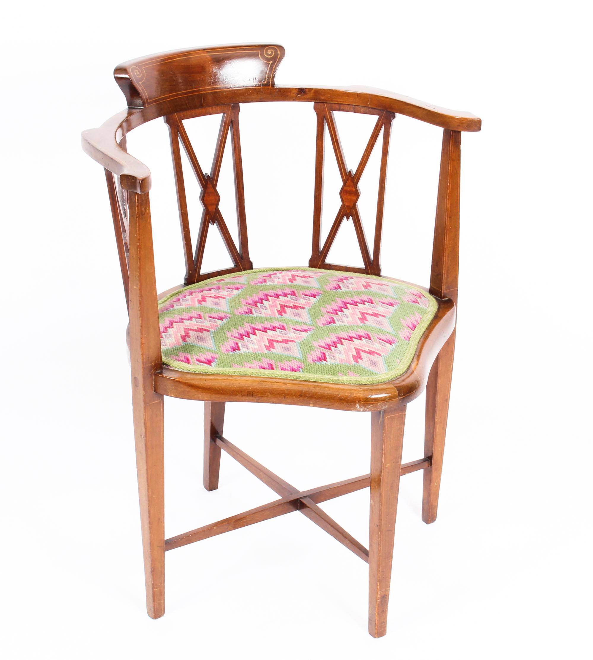 This is a lovely antique Edwardian inlaid mahogany corner arm chair, circa 1900in date.

It has decorative line inlaid decoration and stands on elegant tapering legs united by an h shaped stretcher.

It is a very decorative chair which can be placed