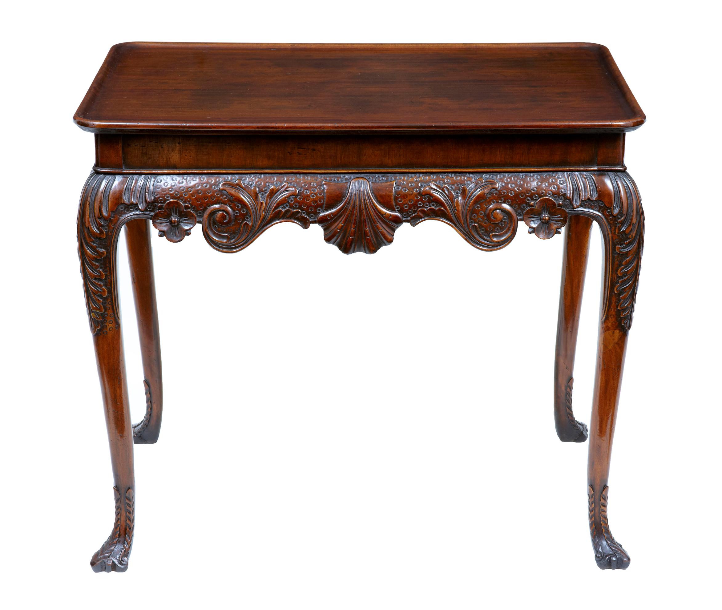 Early 20th century Edwardian mahogany silver table circa 1905

Rectangular dish top surface, with carved acanthus leaf detail to the knee and swags and shell to the apron. Standing on 4 cabriole legs and carved toe feet.

Good rich
