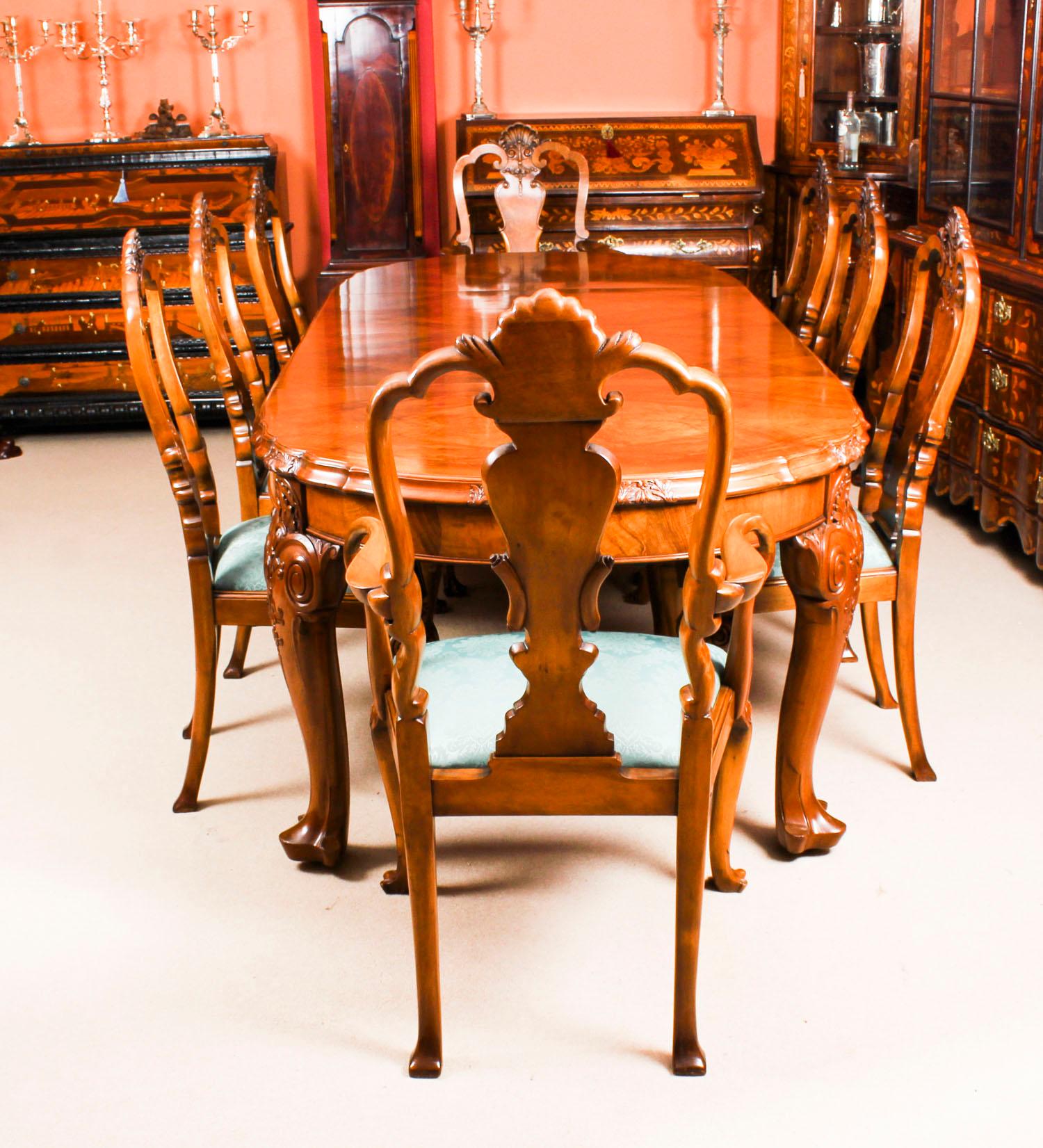This is a fabulous antique Queen Anne Revival burr walnut dining set, comprising a burr walnut dining table and eight burr walnut dining chairs, circa 1900 in date.

The table is of oval shape, has it's original winding mechanism and has two leaves