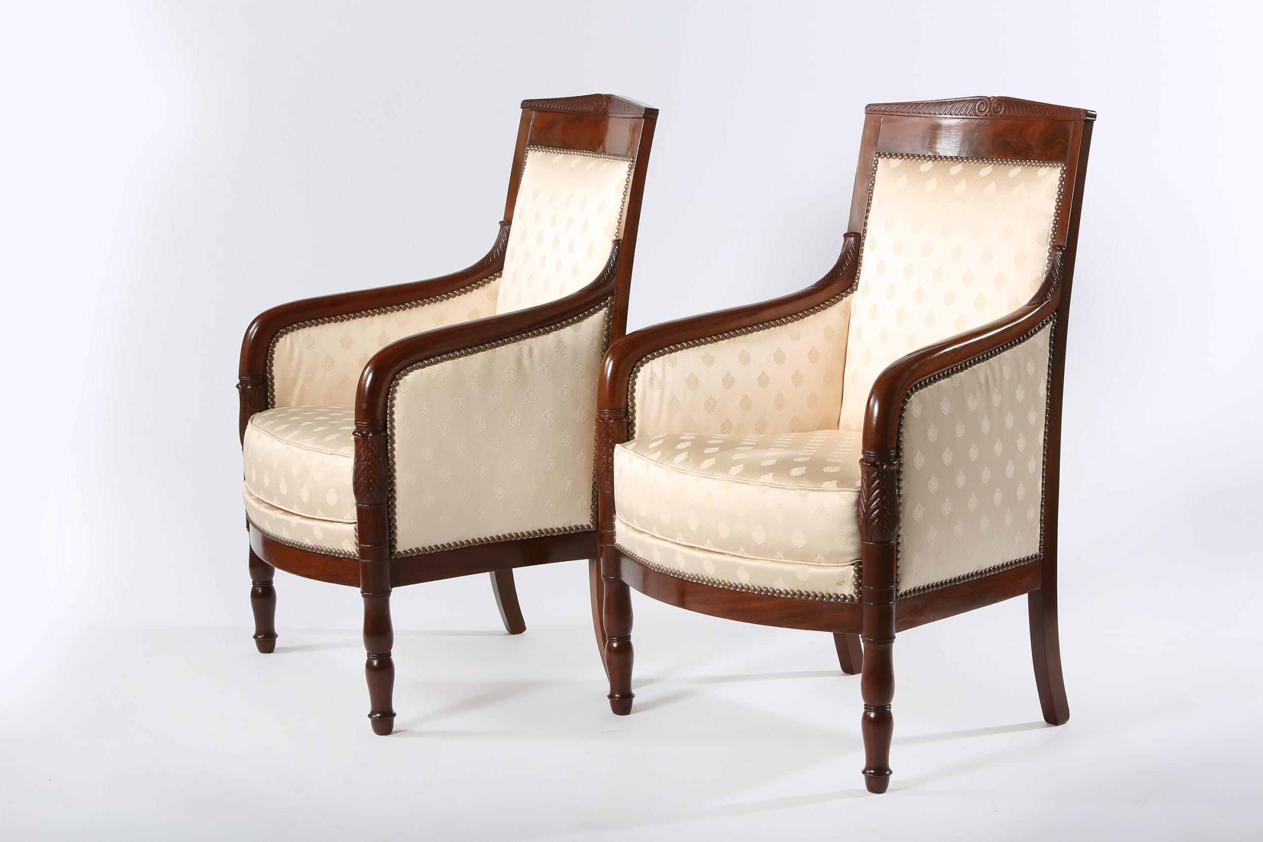 Early 20th century Edwardian mahogany wood framed upholstery set of two armchairs. Signed and dated underneath by the maker. Great vintage condition. Clean upholstery, minor wear consistent with age / use. Each armchair measure about 38 inches high