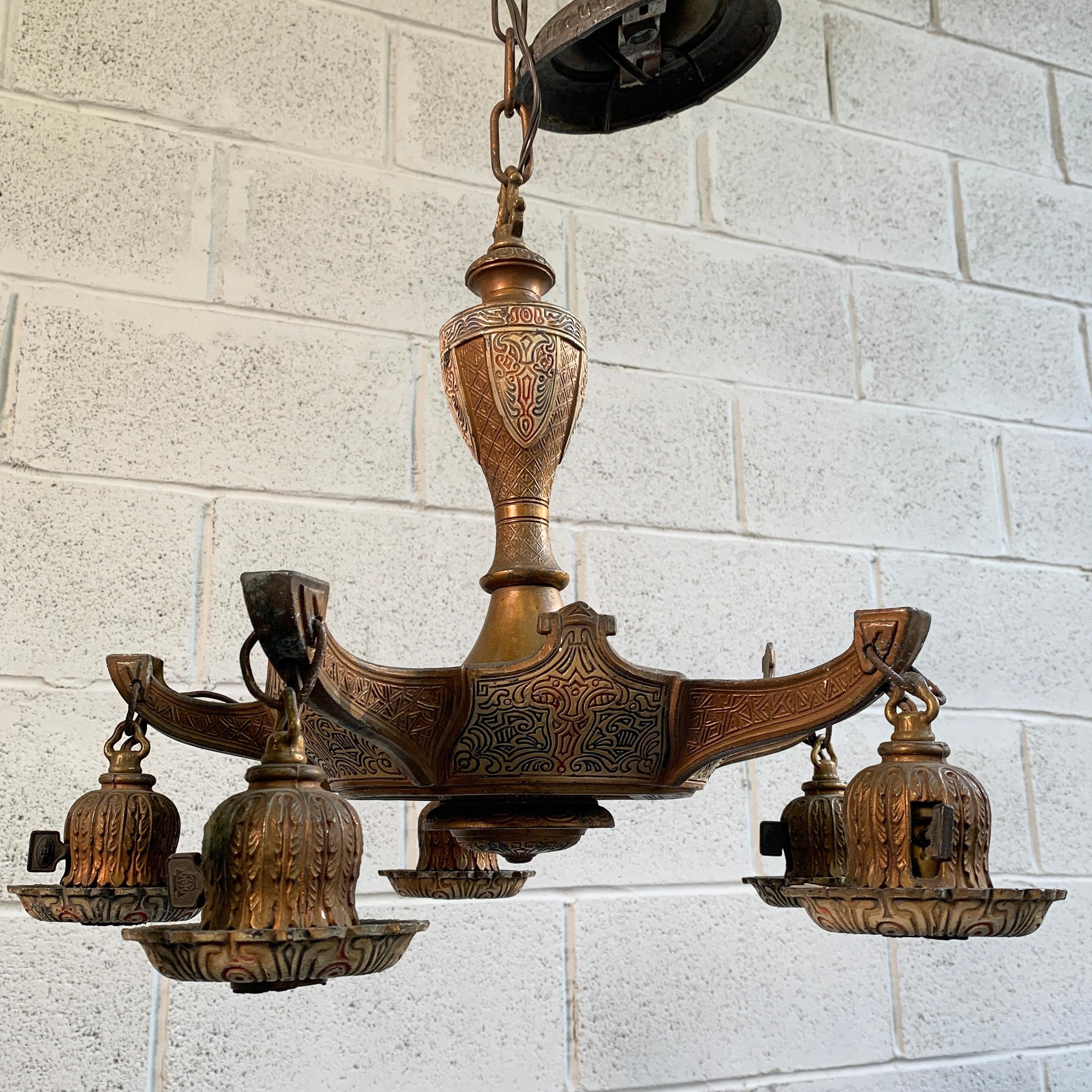 Early 20th century, embossed and painted, white metal, Moroccan chandelier accepts 5 hanging bulbs, up to 75 watts each with canopy. The chandelier hangs at 48