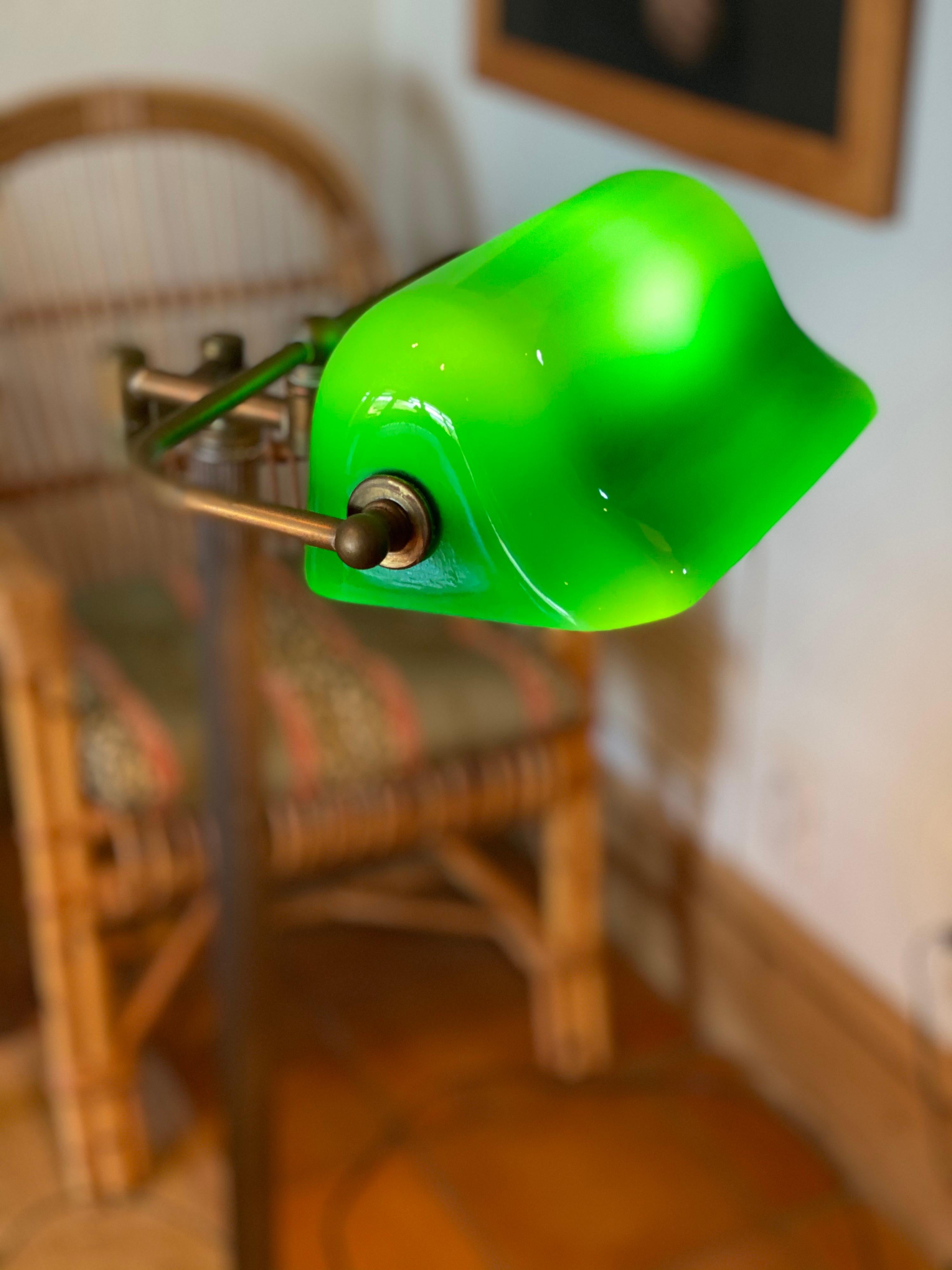 This beautiful emerlite lamp is named for its bluish-green cased glass shade. The green hue it omits was said to encourage positive energy and focus. It's no wonder this lamp would later be coined 'the banker's lamp' as it rose to popularity during