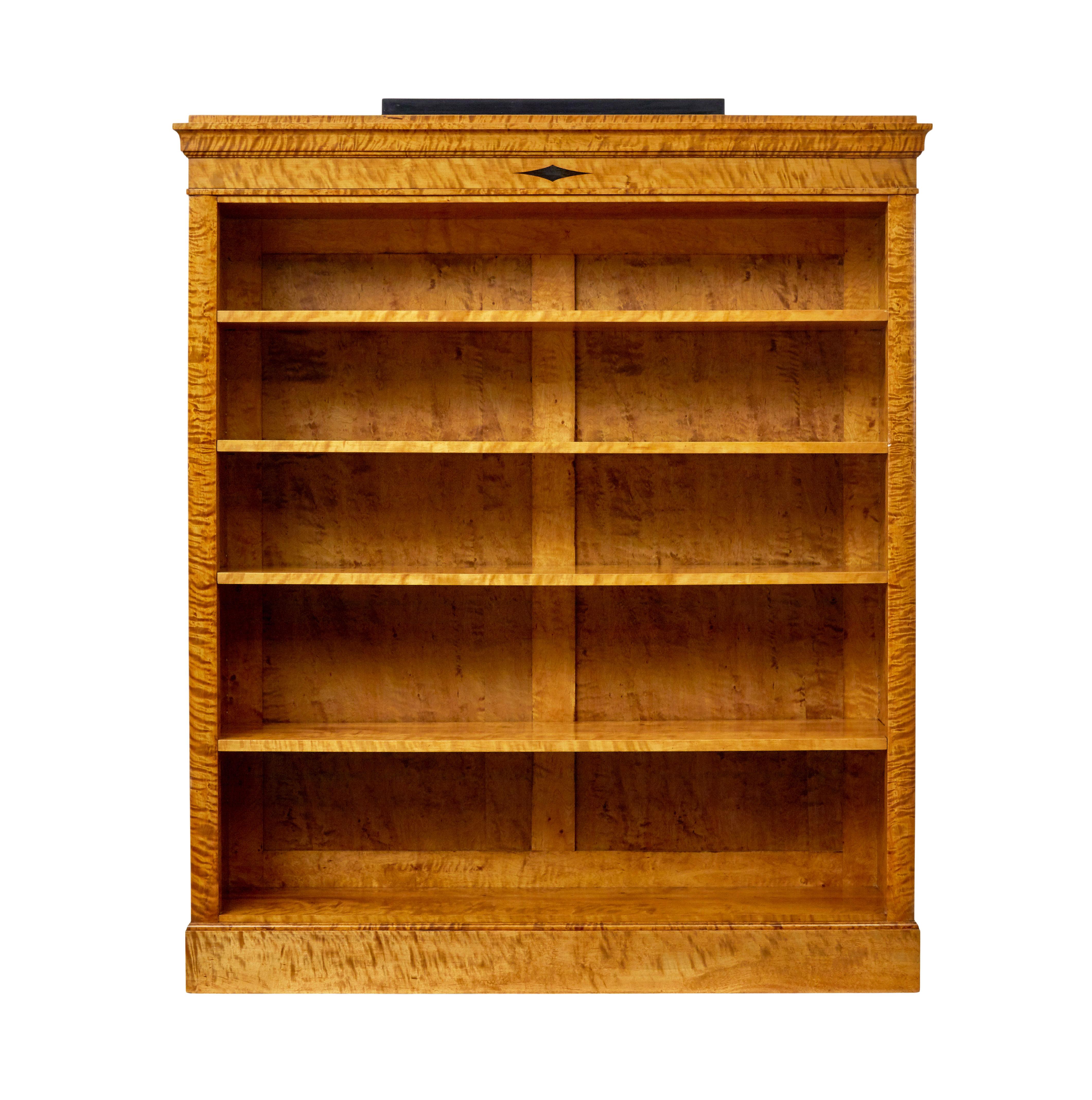 Early 20th century empire revival Swedish birch bookcase circa 1900.

Superb quality piece of Swedish made furniture with influences from Biedermeier and empire periods.

Stepped top with ebonised plinth, with a further ebonised element to the