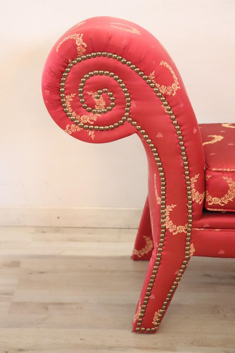 This large empire style bench is truly refined, fully padded and covered in elegant shiny red fabric. Finished on each side, it can also be positioned in the center of the room. Perfect for embellishing small spaces and bedrooms. Small signs of wear