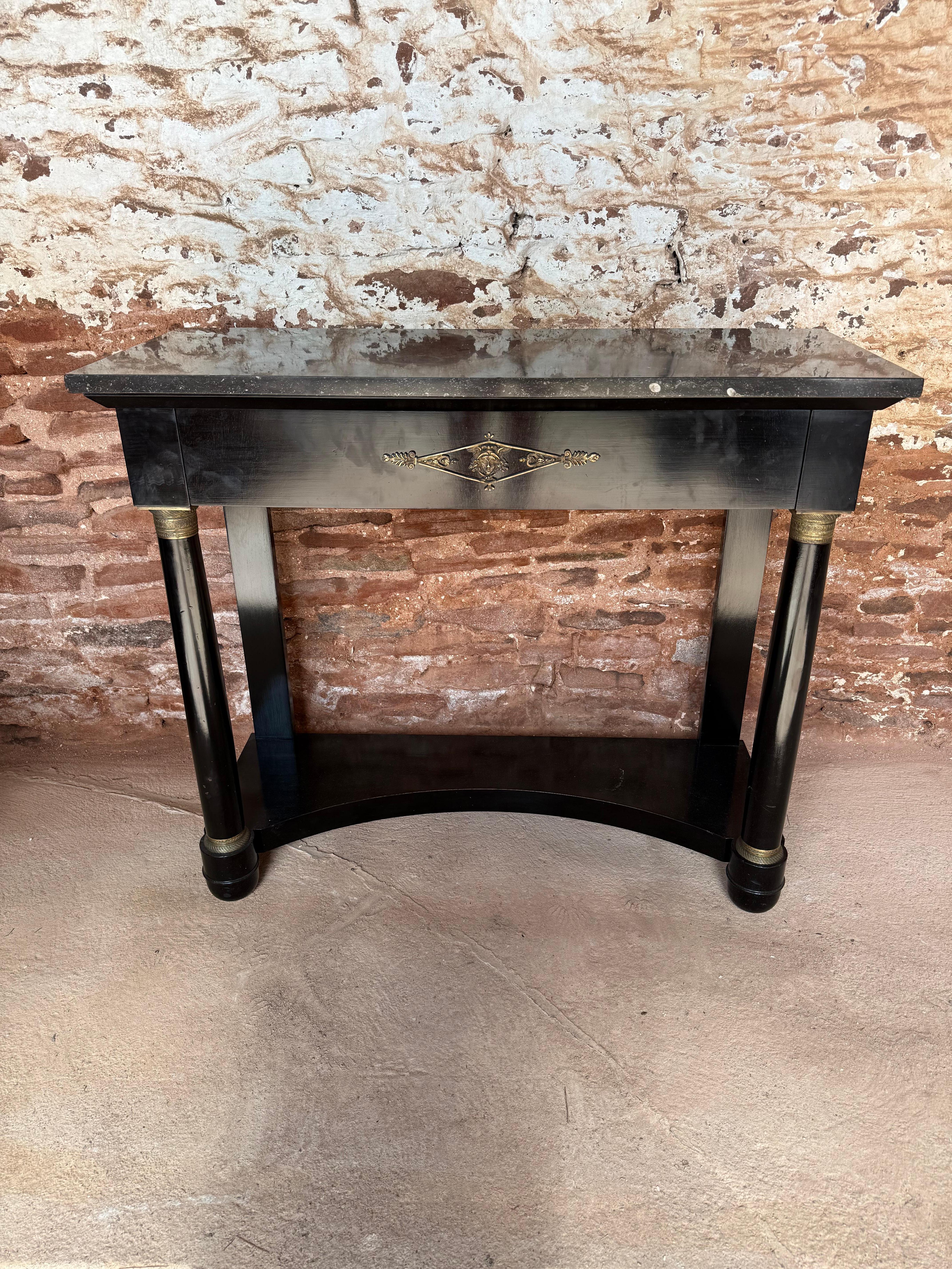 Very stylish early 20th century Empire style console table , came out of an apartment in Paris 

French circa 1920’s with original marble and ormolu mounts , having an ebonised finish 

Width 100 cms or 39 inches 
Depth 40 cms or 15 3/4 inches