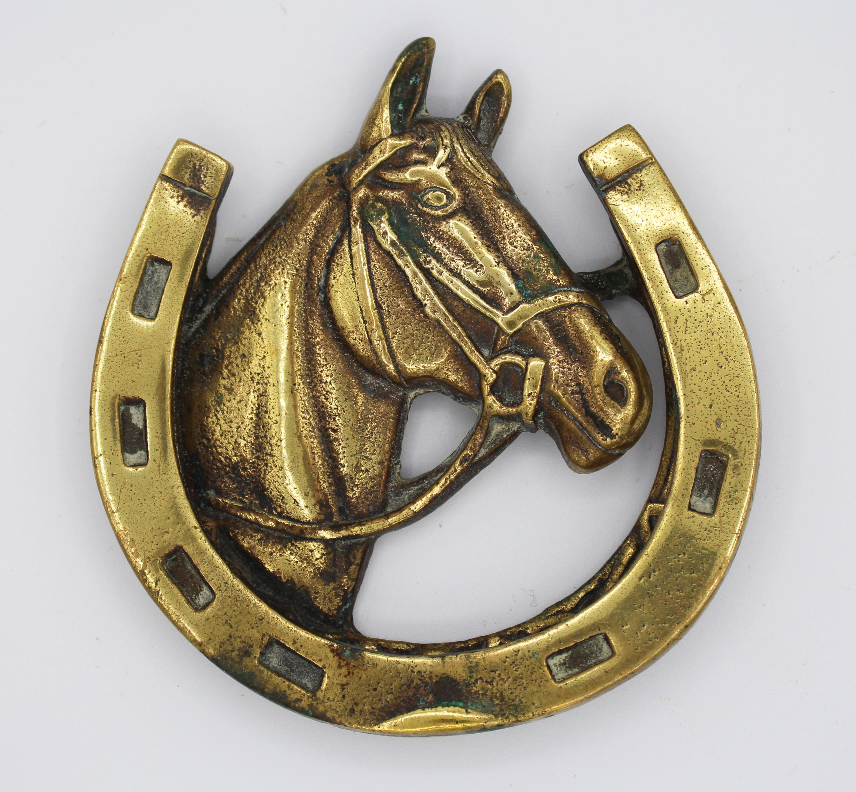 Early 20th century brass horse head & horse shoe doorknocker - also great as a paperweight desk accessory or wall decoration. English.



 