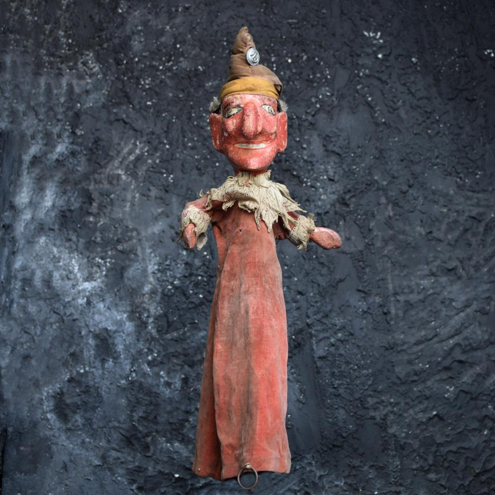 Early 20th century English carved wooden Punch & Judy puppets (lots of Extras)
We are proud to offer a collection of early 20th century carved wooden Punch and Judy puppets, which include a lot of extras. This set comes with linen cloth sausage