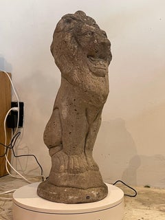 Early 20th Century English Cast Stone Lion Garden Statue with Weathered Patina
