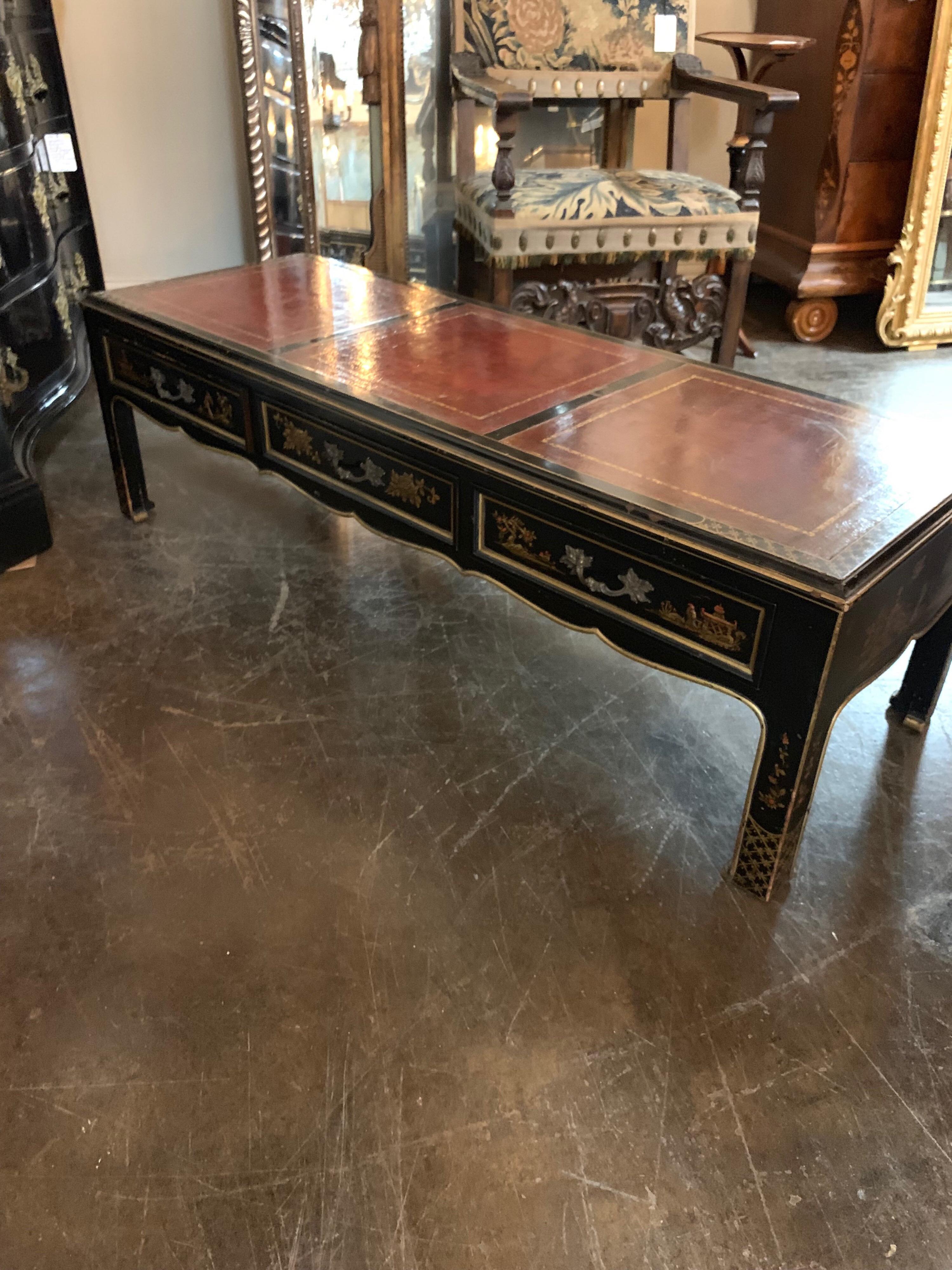 Beautiful and interesting 20th century English low table painted with a raised Chinoiserie design. Nice inlaid leather top as well a great conversation piece!