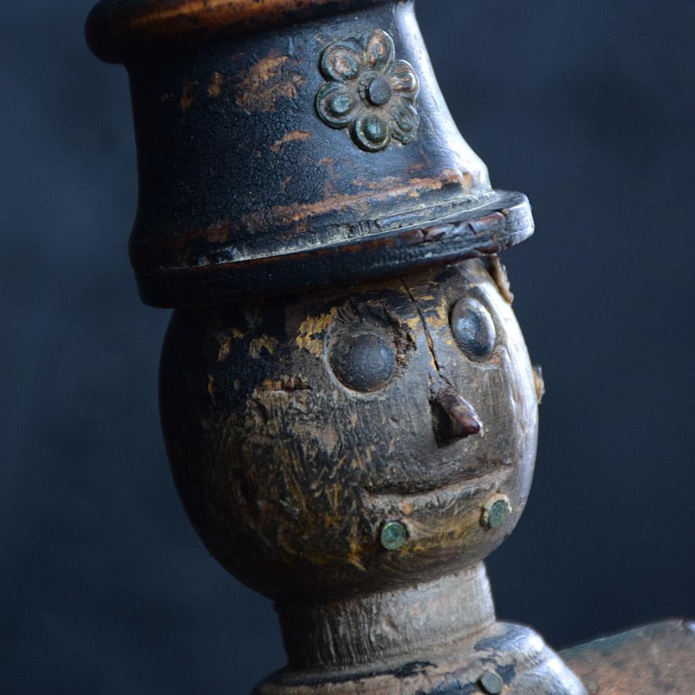 Early 20th century English Folk Art Figure 
We share what we love, and we love this early 20th Century example of an English double helmet policeman figure. Made from pine and detailed with metal studs.

Size in inches Approx.: H 15” x W 3.5” x D