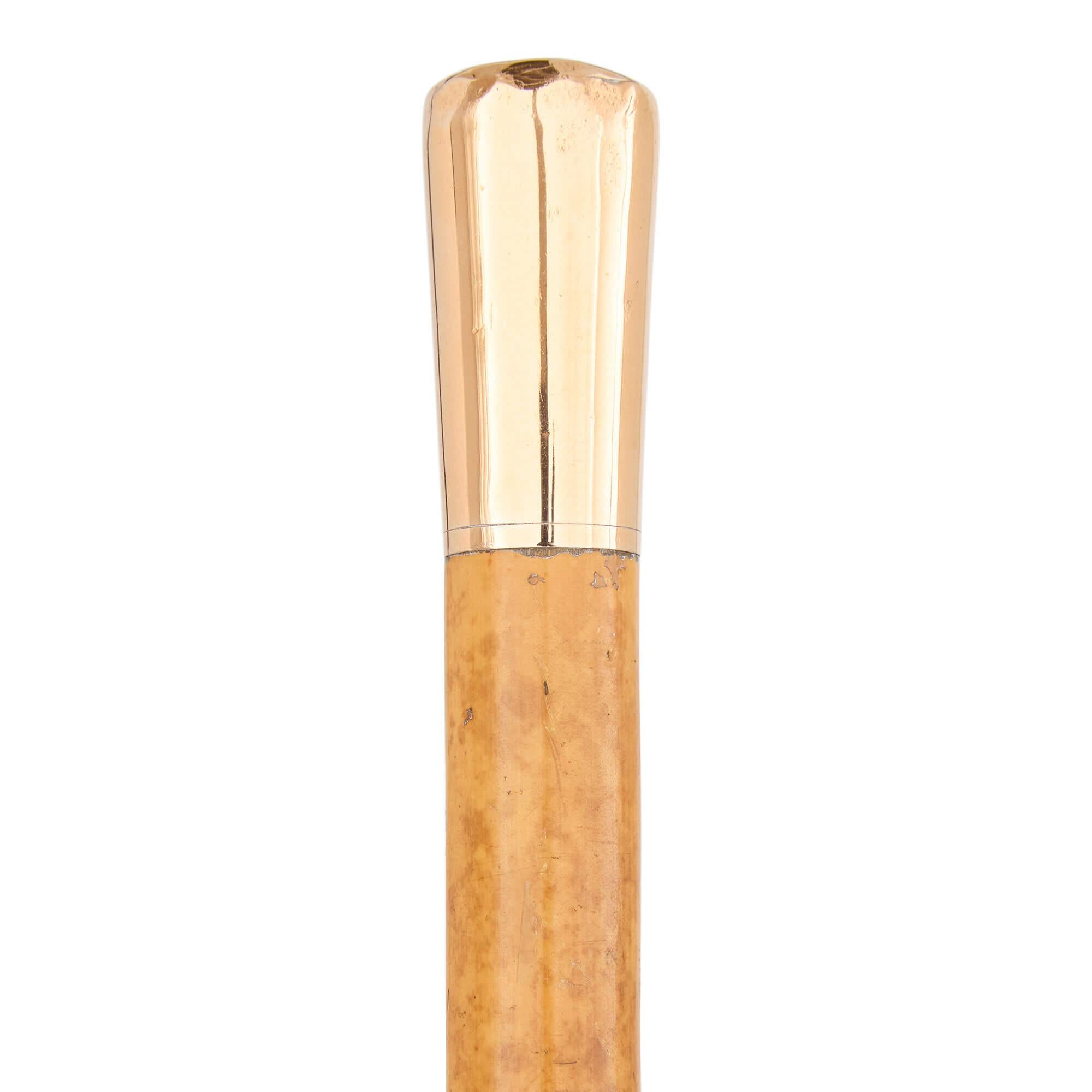 Early 20th century English gold mounted cane by Thomas Brigg & Sons
English, 1919
Height 94cm, diameter 3cm

This exquisitely crafted walking stick, dating to 1919, is the work of Thomas Brigg & Sons, a prestigious English firm celebrated for its