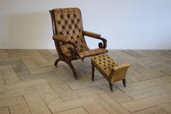 Early 20th Century English Library Armchair and Foot Stool