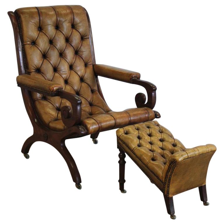 Early 20th Century English Library Armchair and Foot Stool For Sale
