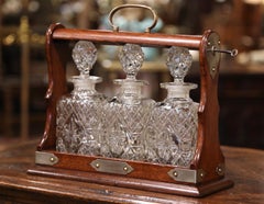 Early 20th Century English Oak and Brass Tantalus with Cut-Glass Decanters