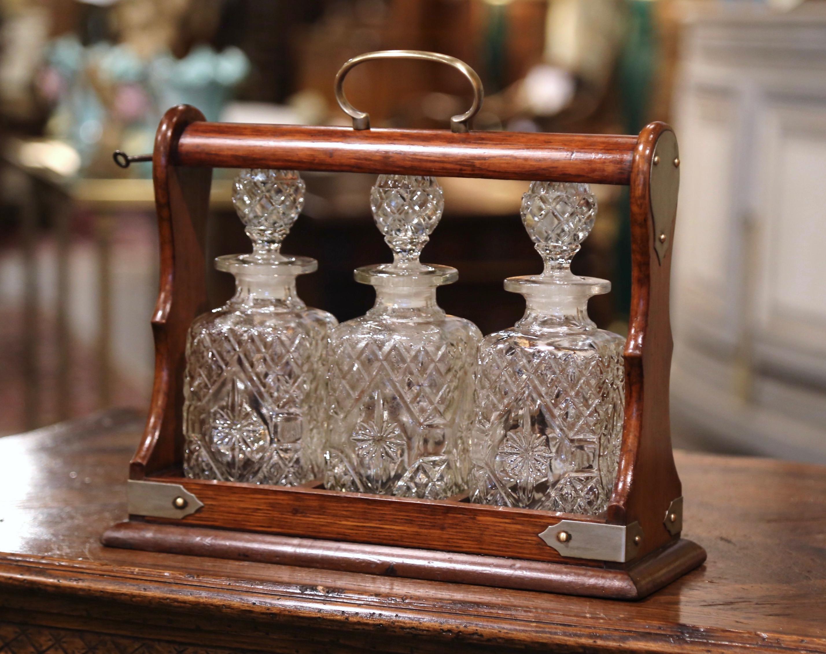 Early 20th Century English Oak and Brass Tantalus with Cut-Glass Decanters 1