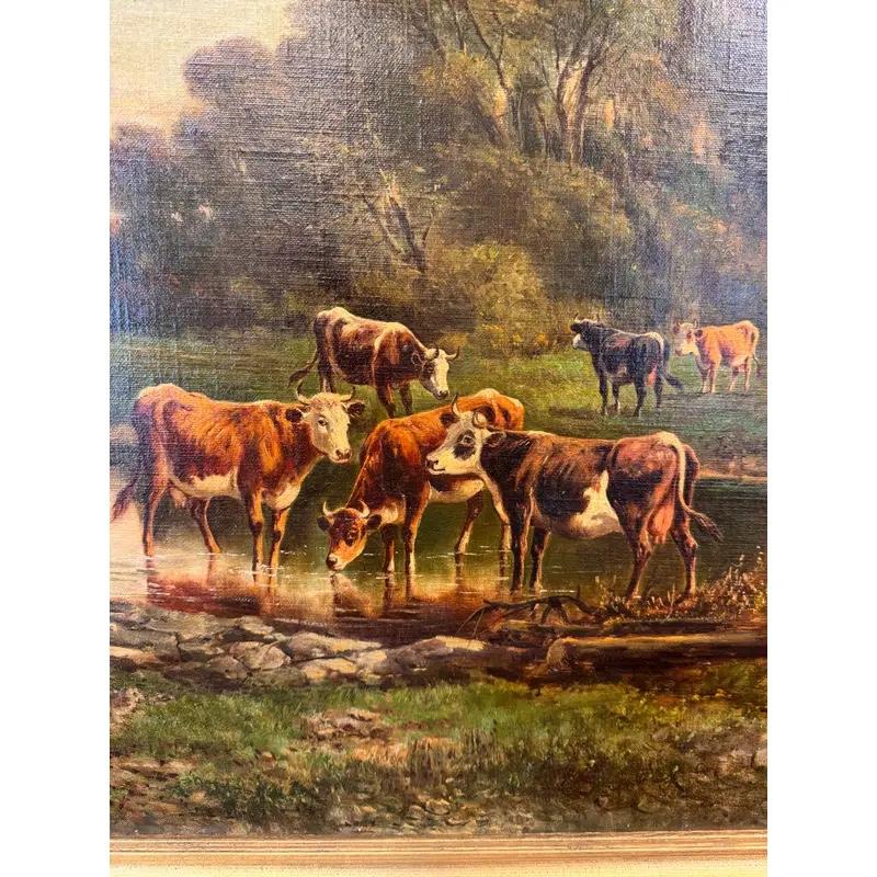 Esta pintura al óleo sobre lienzo en un marco resistente es perfecta para los amantes de los animales, de la naturaleza o para cualquiera que desee un toque de estilo granjero en su colección de arte. Muestra un pequeño rebaño de vacas bebiendo,