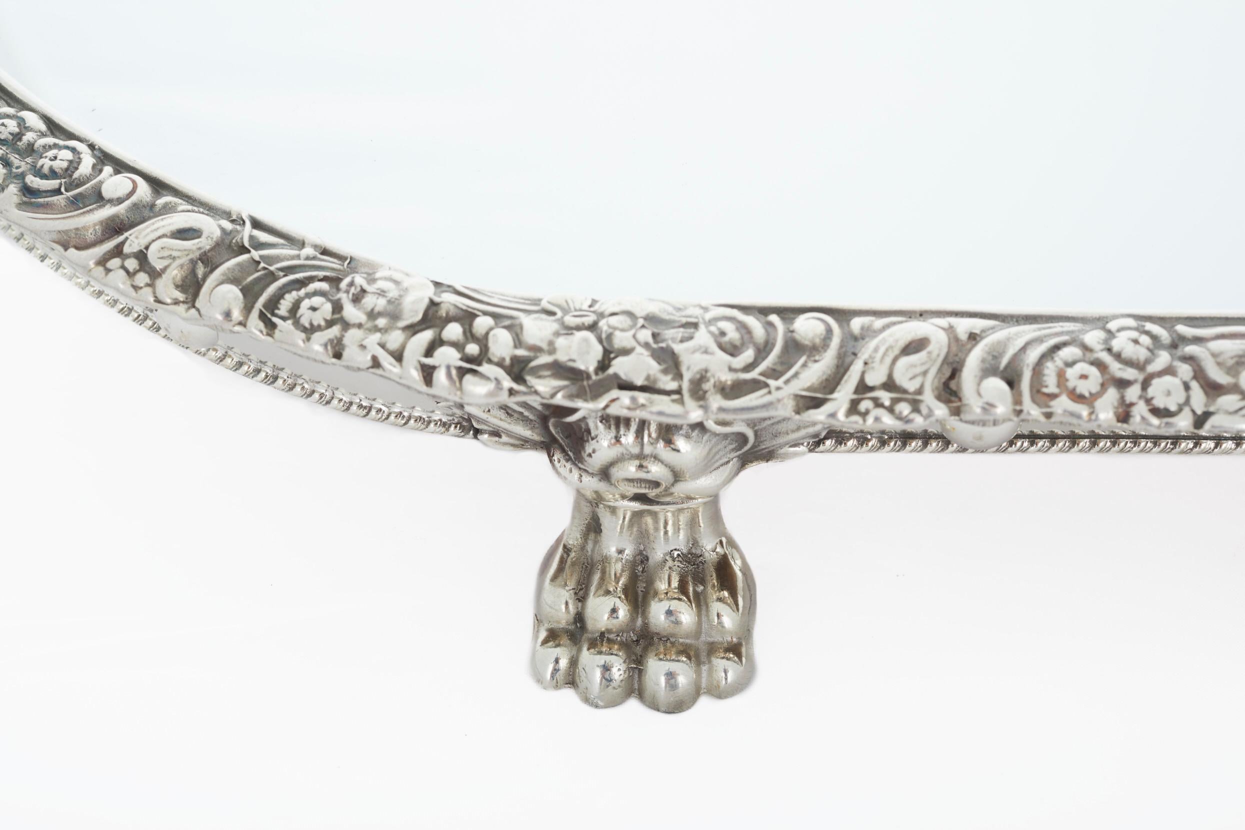 Early 20th century English silver plate frame surtout de table mirrored plateau. The plateau features a silver plate framed with exterior floral boarding details and wood underneath. The plateau is in great condition. Minor wear consistent with age