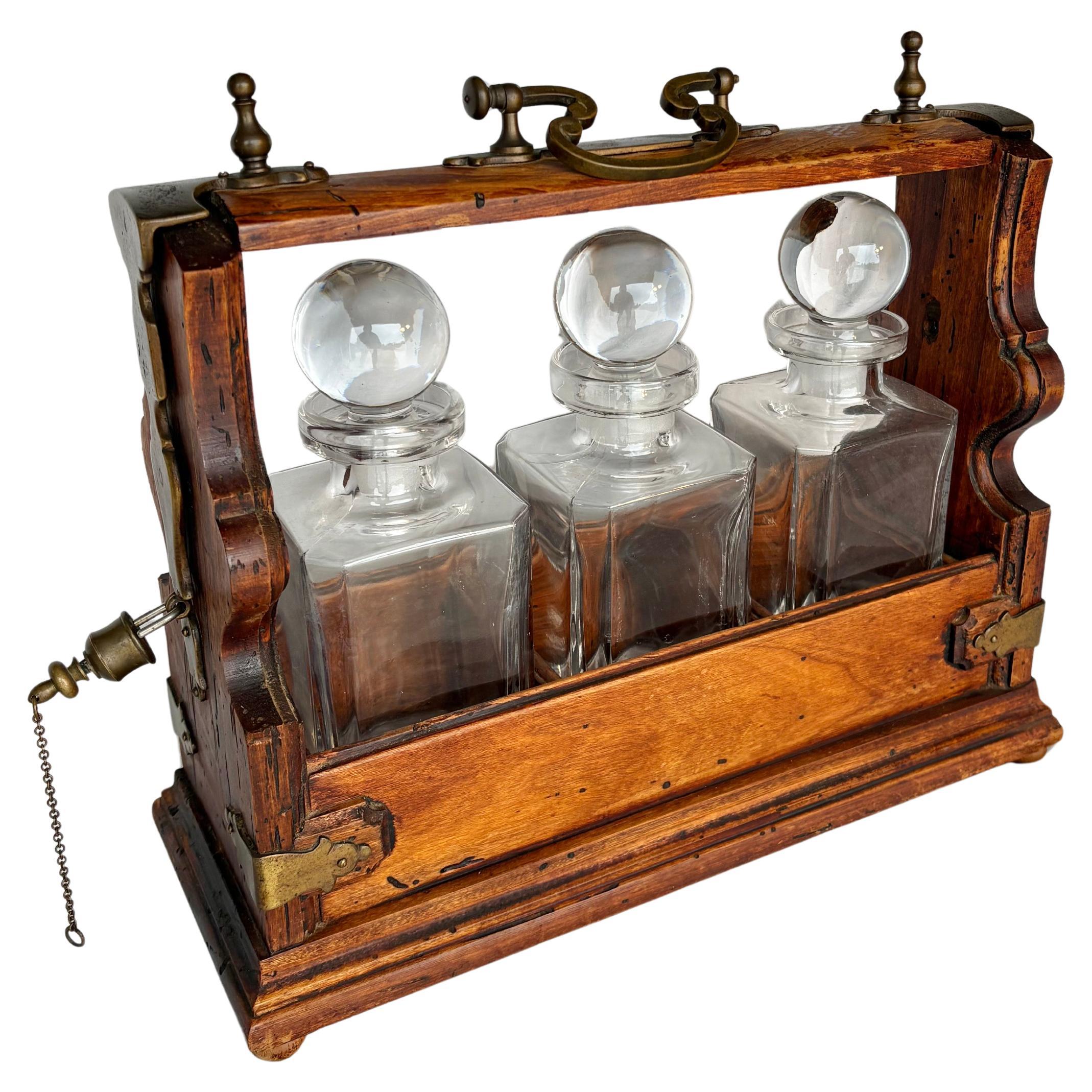 Early 20th Century English Oak Three Decanter Tantalus For Sale