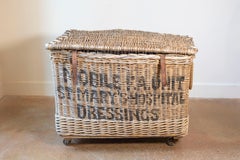 Early 20th Century English Wicker Laundry Basket on Wheels with Stenciled Labeli