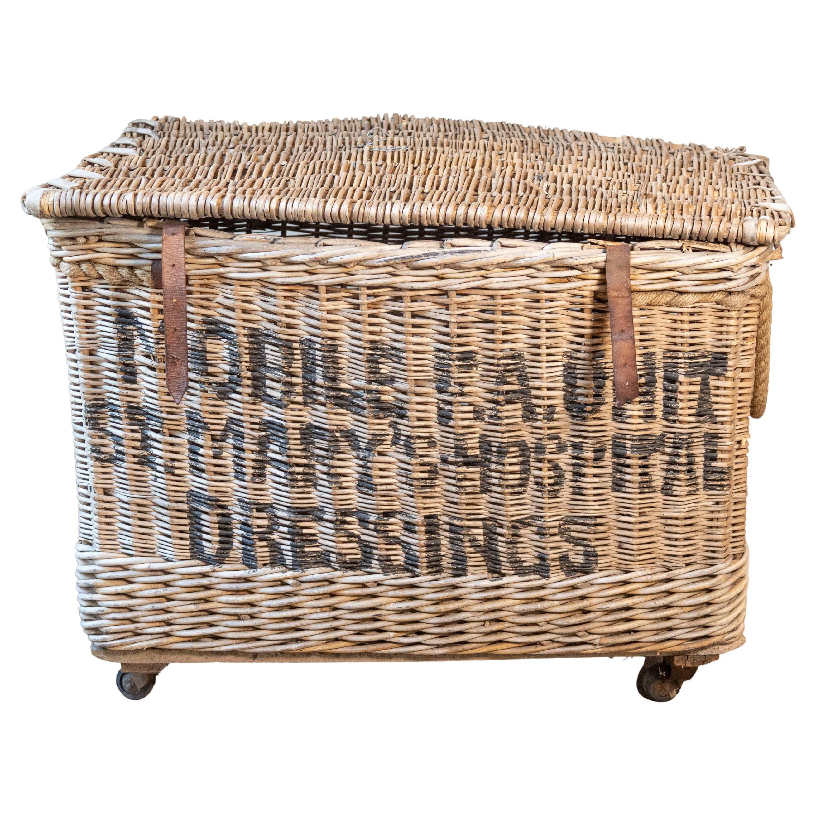 Early 20th Century English Wicker Laundry Basket on Wheels with Stenciled Labeli