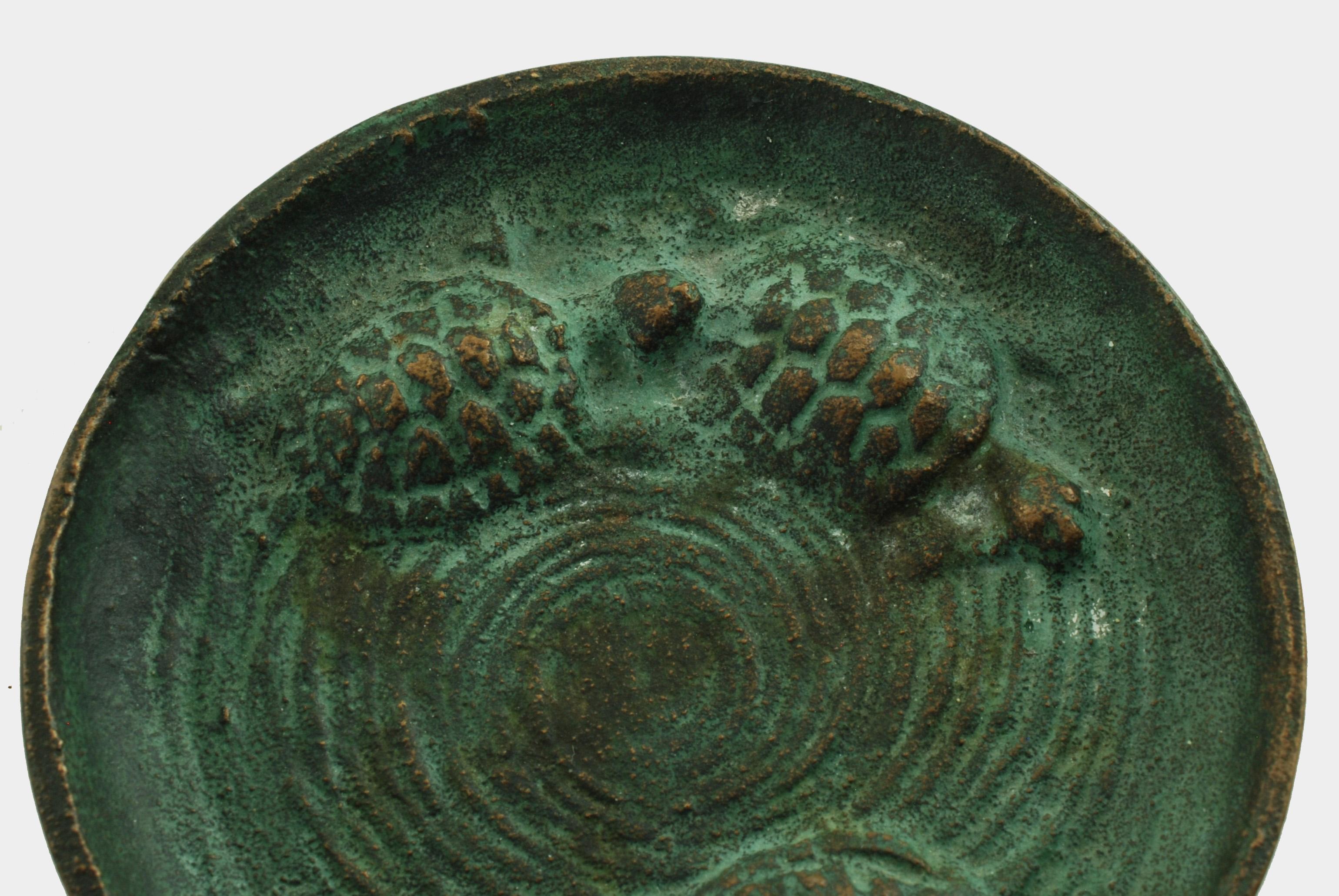 This bronze dish was made by multitalented artist and sculptor Edward Timothy Hurley (1869-1950). E.T. Hurley studied at the Art Academy of Cincinnati where he excelled in drypoint etching under the tutelage of noted painter Frank Duveneck. Hurley