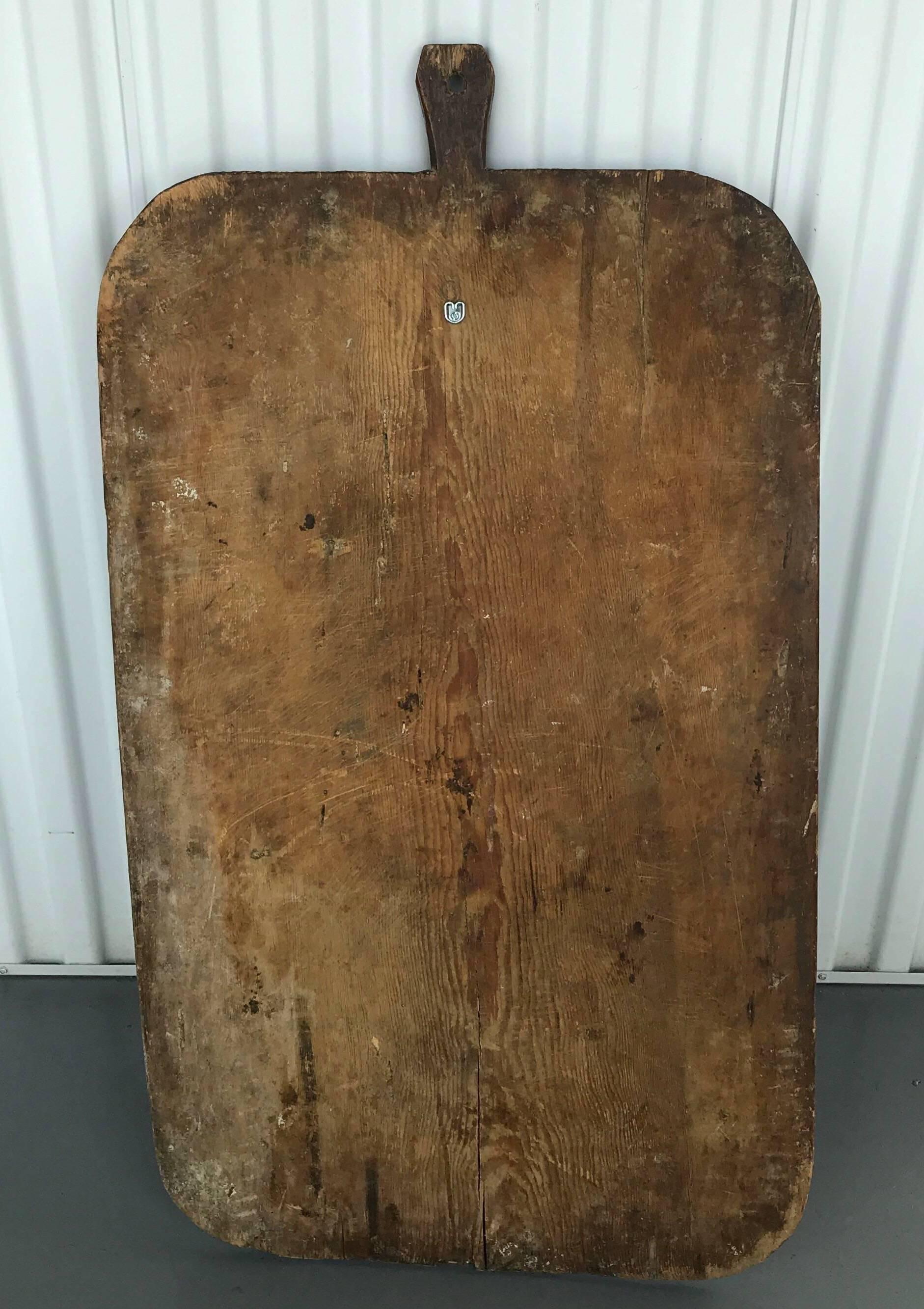 Early 20th century European cutting or bread board from France




Dimensions: Board total is 41 in. H x 22.25 in. W x .75 in. D; excluding handle: 37.5 in. H x 22.25 in. W with a handle that is 3.5 in. H x 2.25 in. W