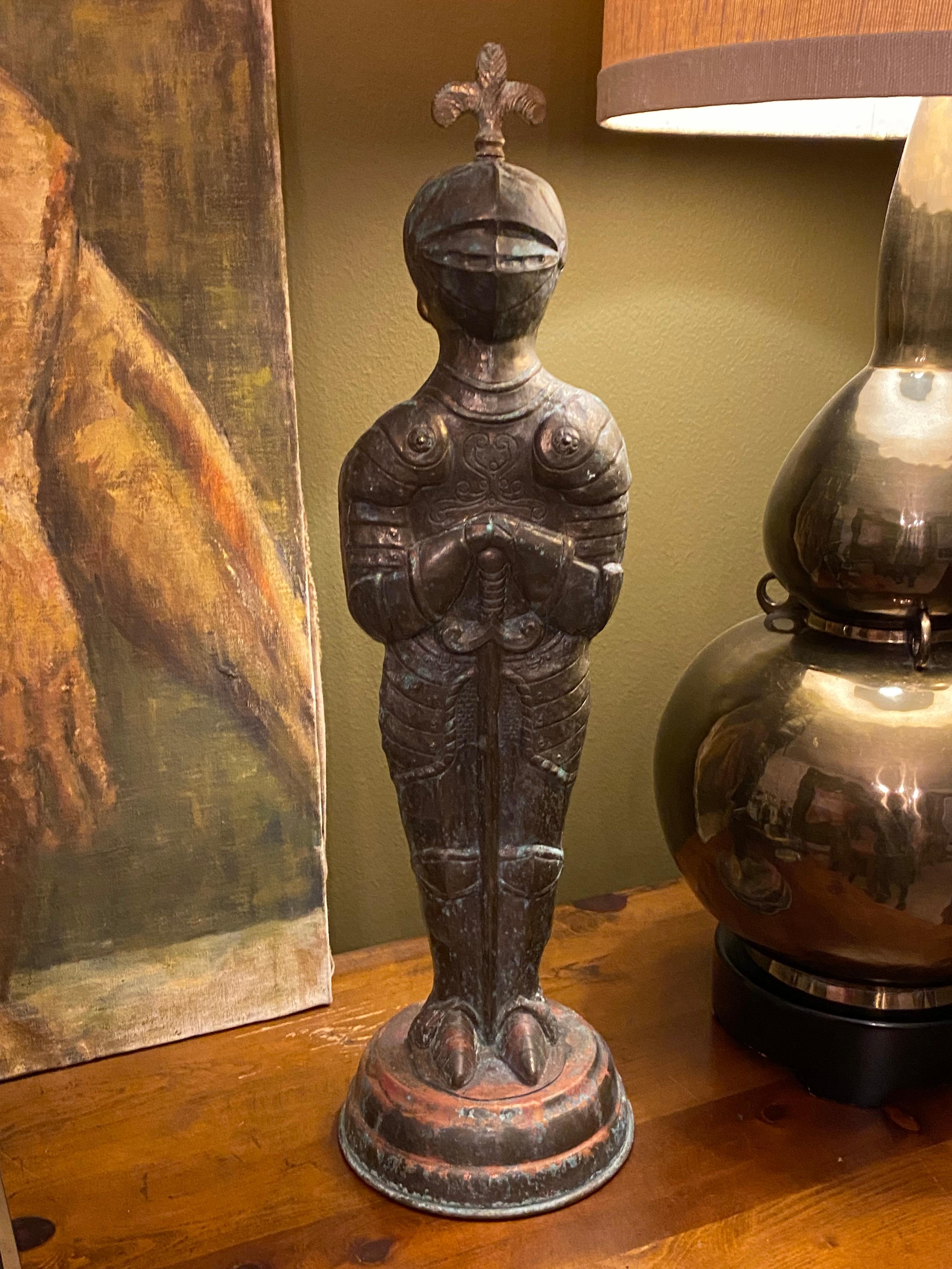 A one-of-a-kind copper, brass and bronze statue of a European knight, probably French, with an incredibly rich and colorful patina. This piece will have a strong presence in any room. Standing at 24.5