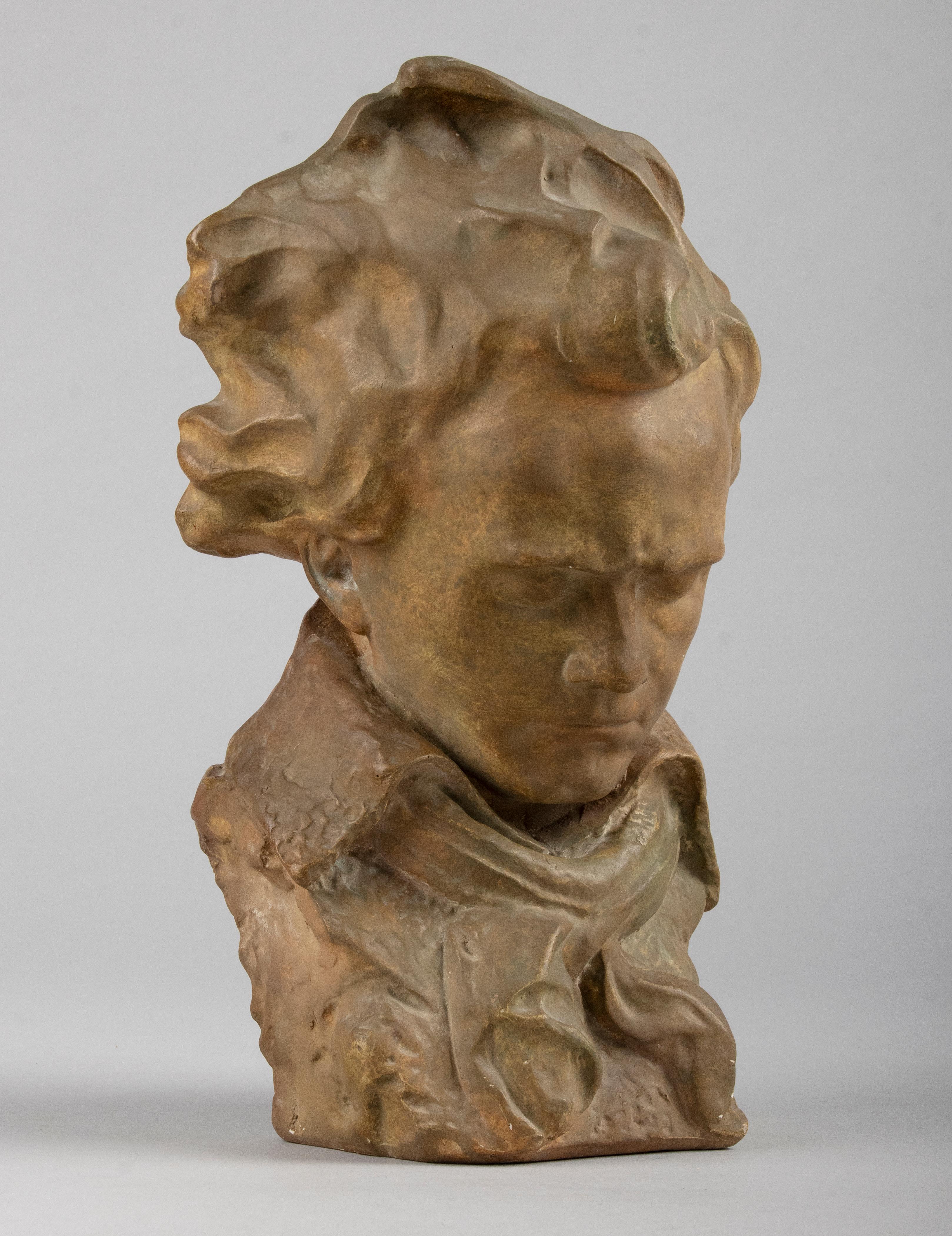 Early 20th century bust of Beethoven. The statue is made of solid plaster, patinated in beautiful terracotta / bronze colors. The sculpture has a beautiful expressive appearance, it is Beethoven with his characteristic gruff, introverted, thoughtful