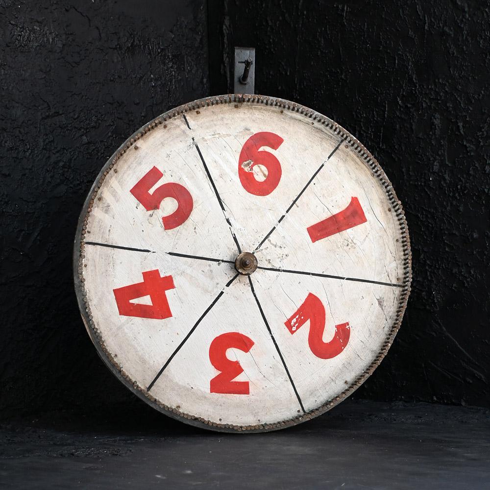 Early 20th Century Fairground/Carnival Roulette Games Wheel 

A charming and highly decorative early 20th Century handmade scratch-built fairground / carnival games roulette wheel. This hand painted example is made from an old wheel of sorts,