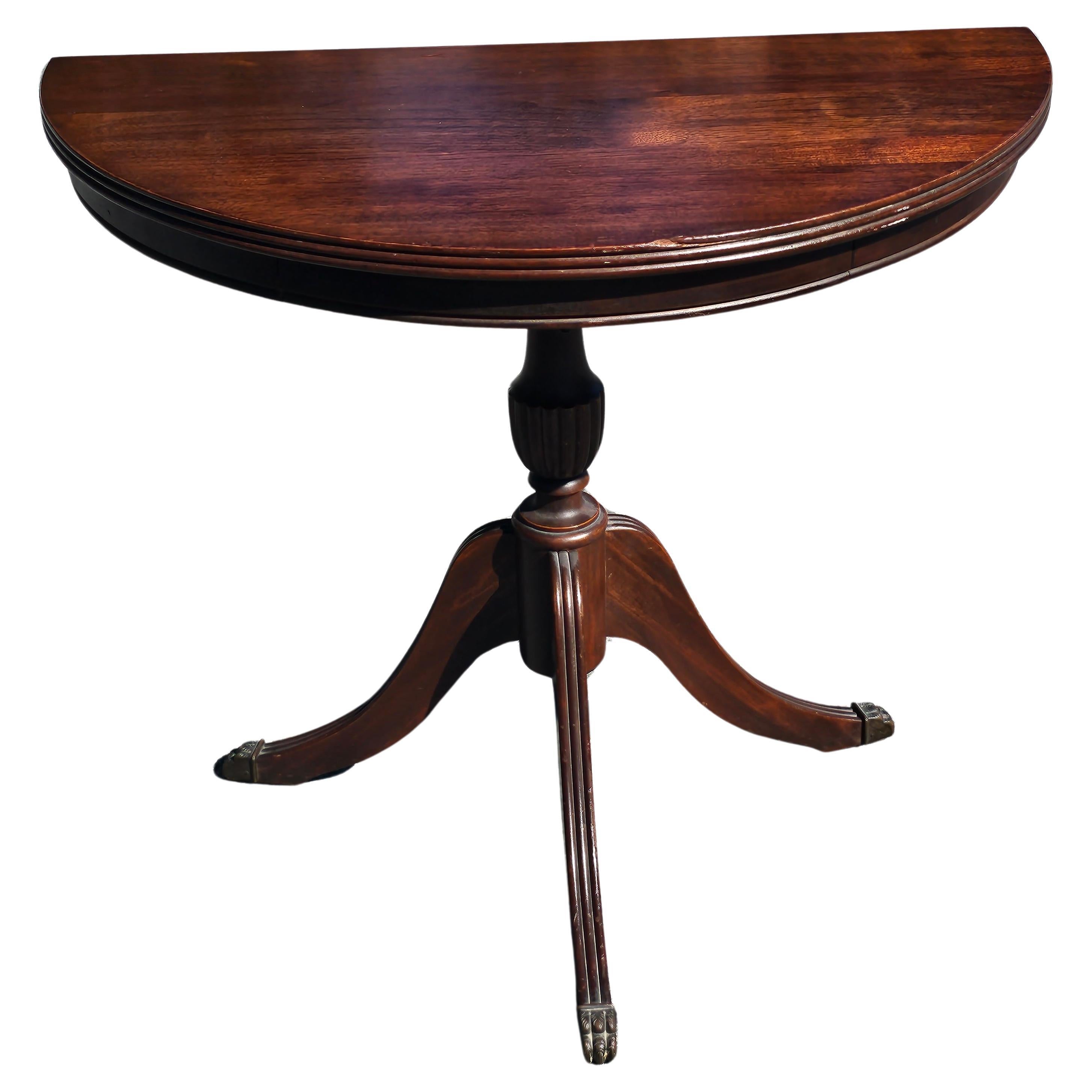 Early 20th Century Federal Mahogany Pedestal Trifid Demilune Table with brass paw feet. Measures 25