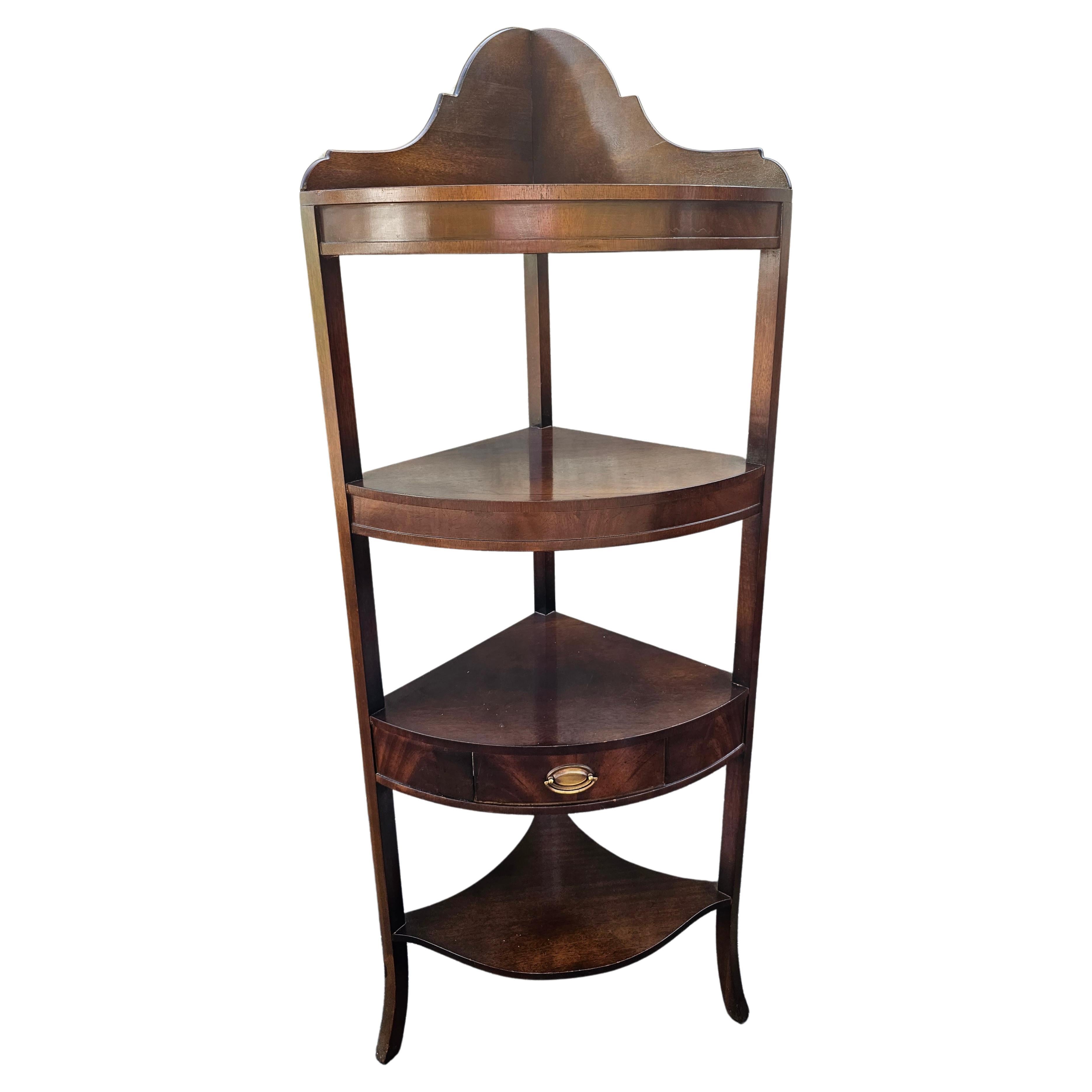 An early 20th century four-tier Federal Style corner shelf with one drawer measuring 22