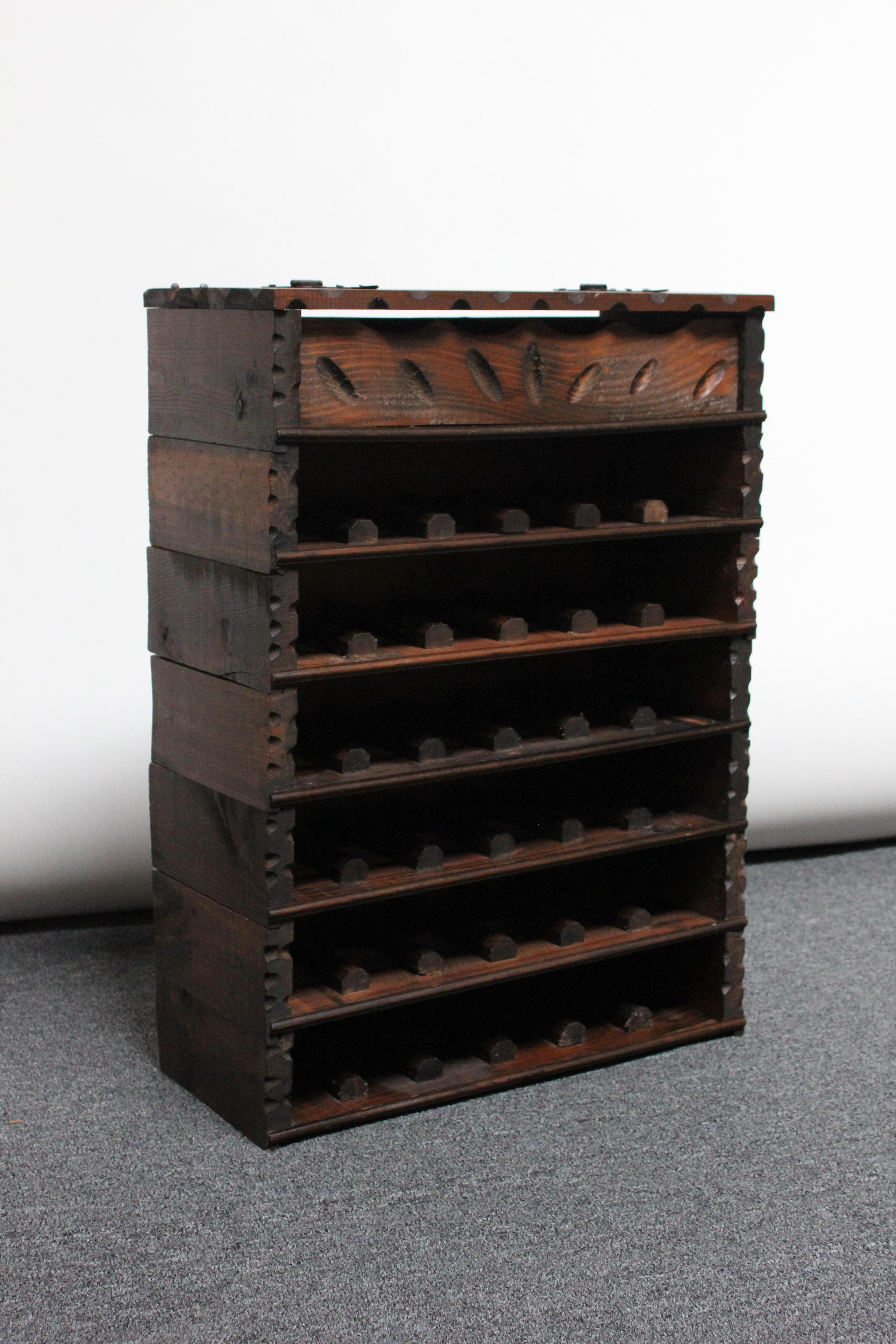Founded in 1896, Federico Paternina established his winery on a site featuring cellars dug in the 16th century in Ollauri, Rioja Alta. 
These seven cedar racks, presumably early 20th Century promotional items, stack to form ample storage suitable