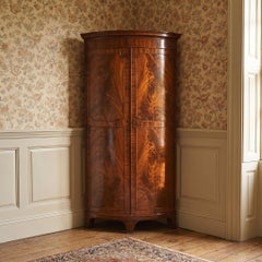 Early 20th Century Figured Mahogany Bowfront Corner Wardrobe