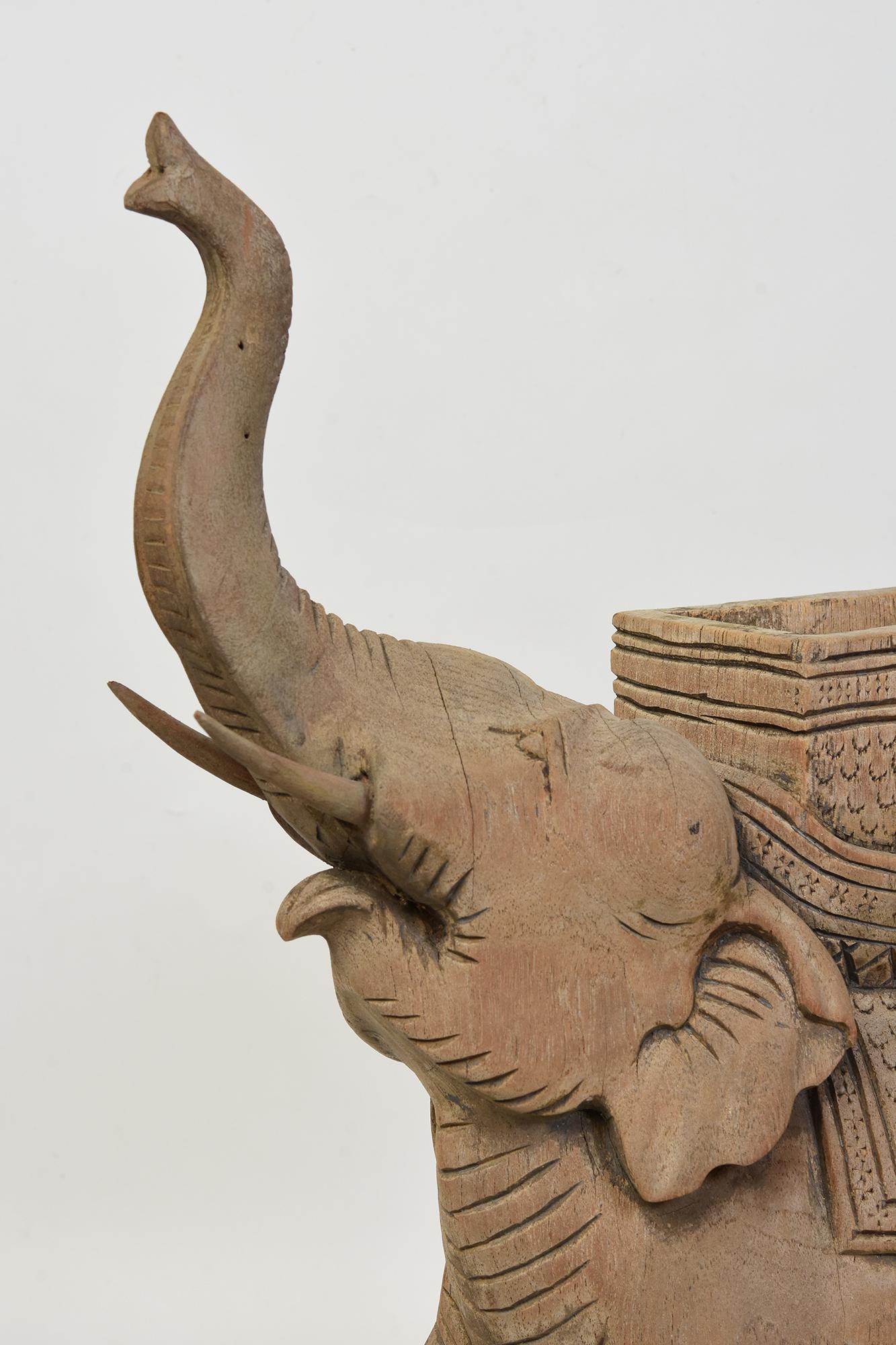 Finely carved Asian wooden walking elephant animal statue.

Age: Early 20th Century
Size: Height 46 C.M. / Width 13 C.M. / Length 33 C.M.
Condition: Nice condition overall (some expected degradation due to its age).