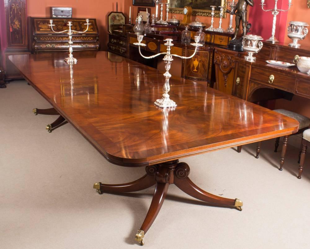 This is an elegant antique dining table in the Regency Manner that can comfortably seat up to fourteen people, dating from circa 1900.

The table has two leaves which can be added or removed as required to suit the occasion and it stands on twin