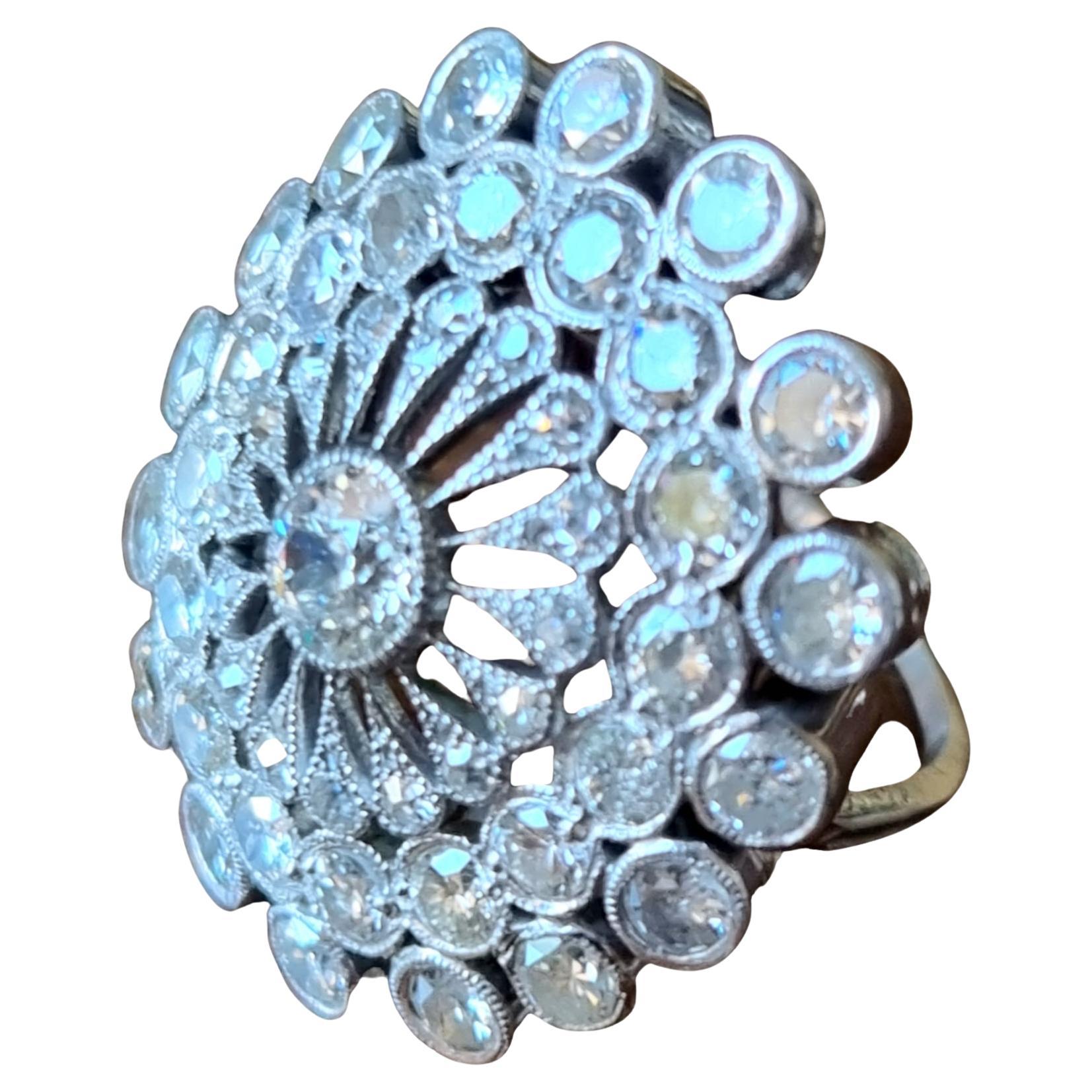 Early 20th Century Floral Spray Diamond Platinum Ring-
Mounted in platinum, handcrafted.
Rosette ring in platinum comprising an old-cut and brilliant-cut diamond flower, estimated weight approx. 4.45 carats. 
1 central Old European cut diamond