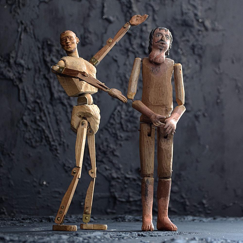 Early 20th Century Folk art articulated pine figures 

An unusual pair of early 20th Century hand crafted articulated pine figures. One displaying a large medical condition on his face, and the other is made from lots of brass bolt and joints with