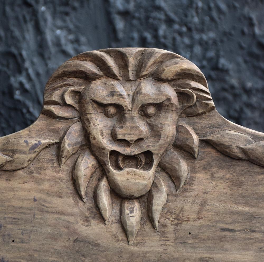 Early 20th century folk art carved oak lion panel.

We are proud to offer a unique hand carved oakwood Folk Art panel in the form of a lion’s head circa 1930. This item was uncovered in an old barn find earlier this month. The barn was once owned