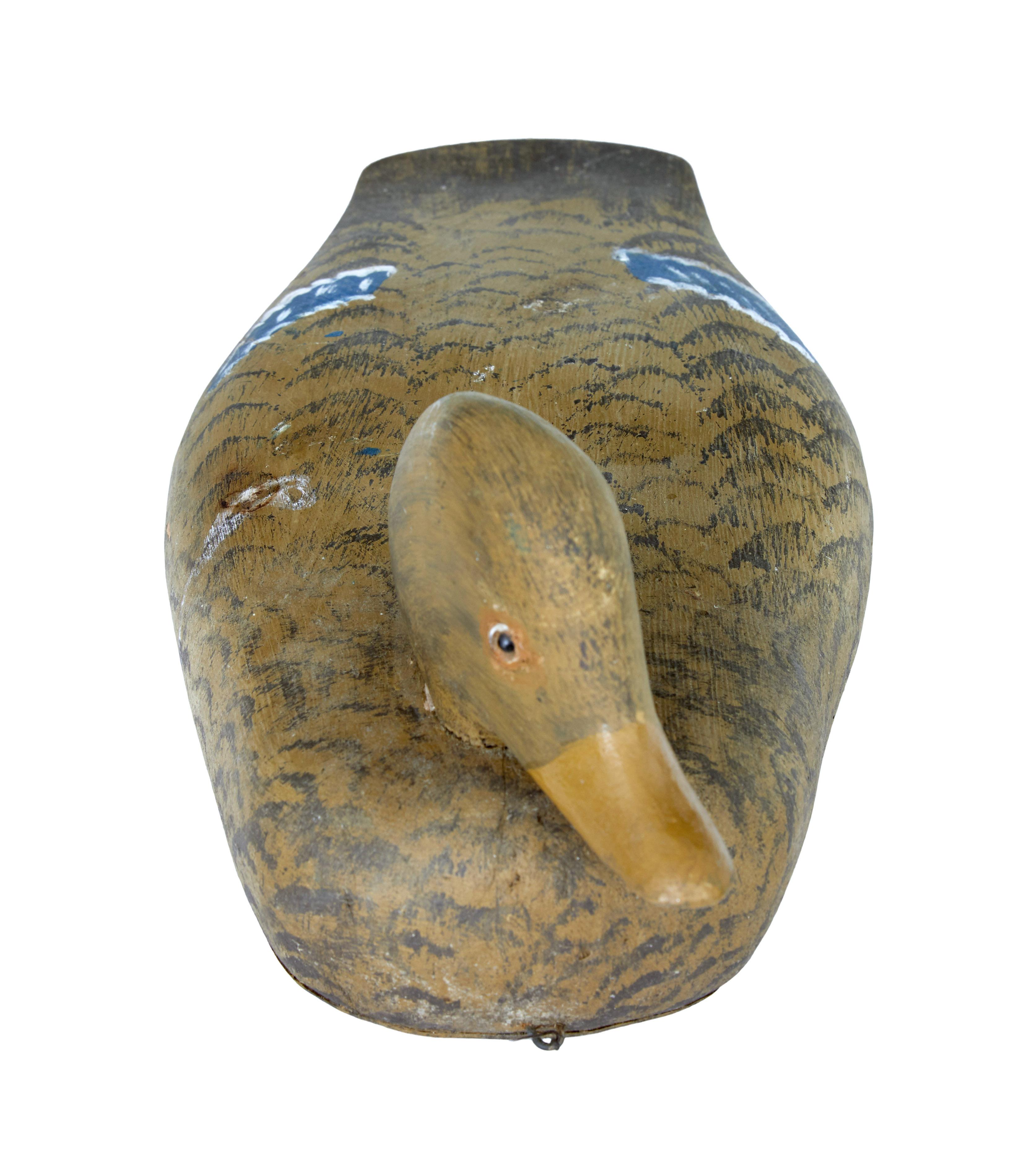 Early 20th century Folk Art Swedish decoy duck, circa 1930.

Swedish decoy duck hand painted to represent a hen duck. Realistically hand painted and in good condition.

Minor expected paint losses.