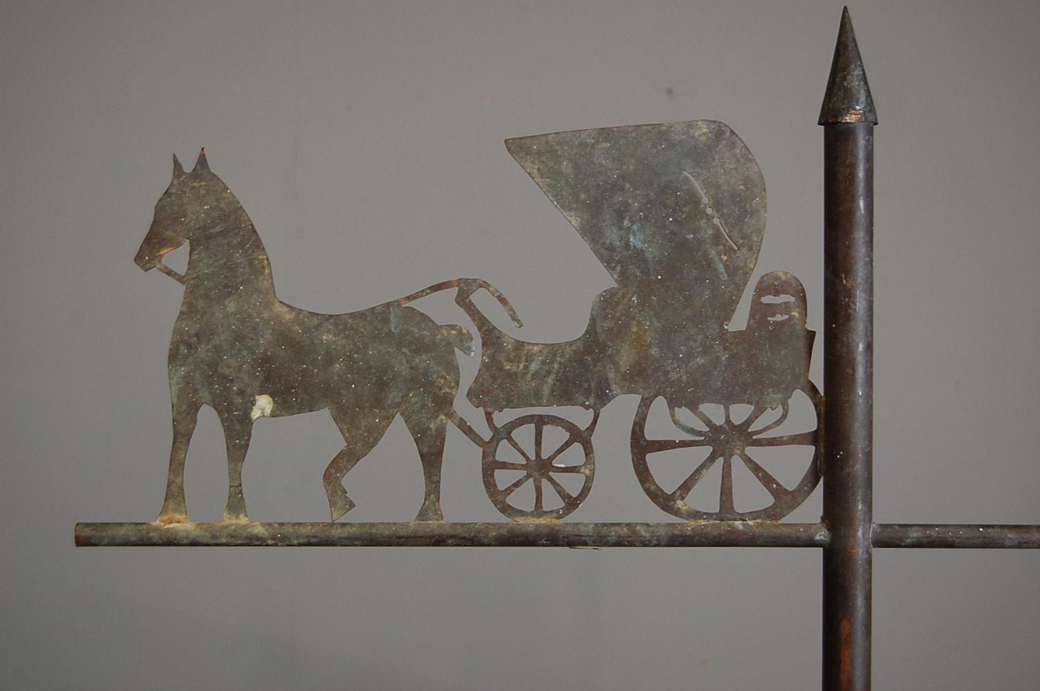 Charming folky horse and carriage weather vane, heavy gauge copper, with a light verdigris patinated surface. Later stand. France early 20th century.
 