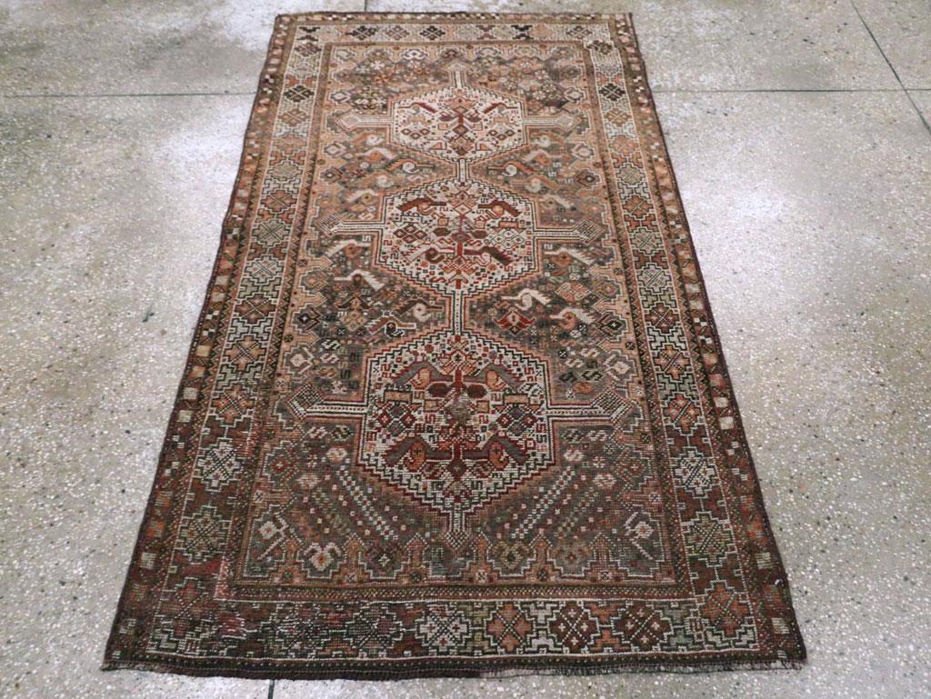 This Early 20th century Persian Shiraz rug, measuring 3' 5